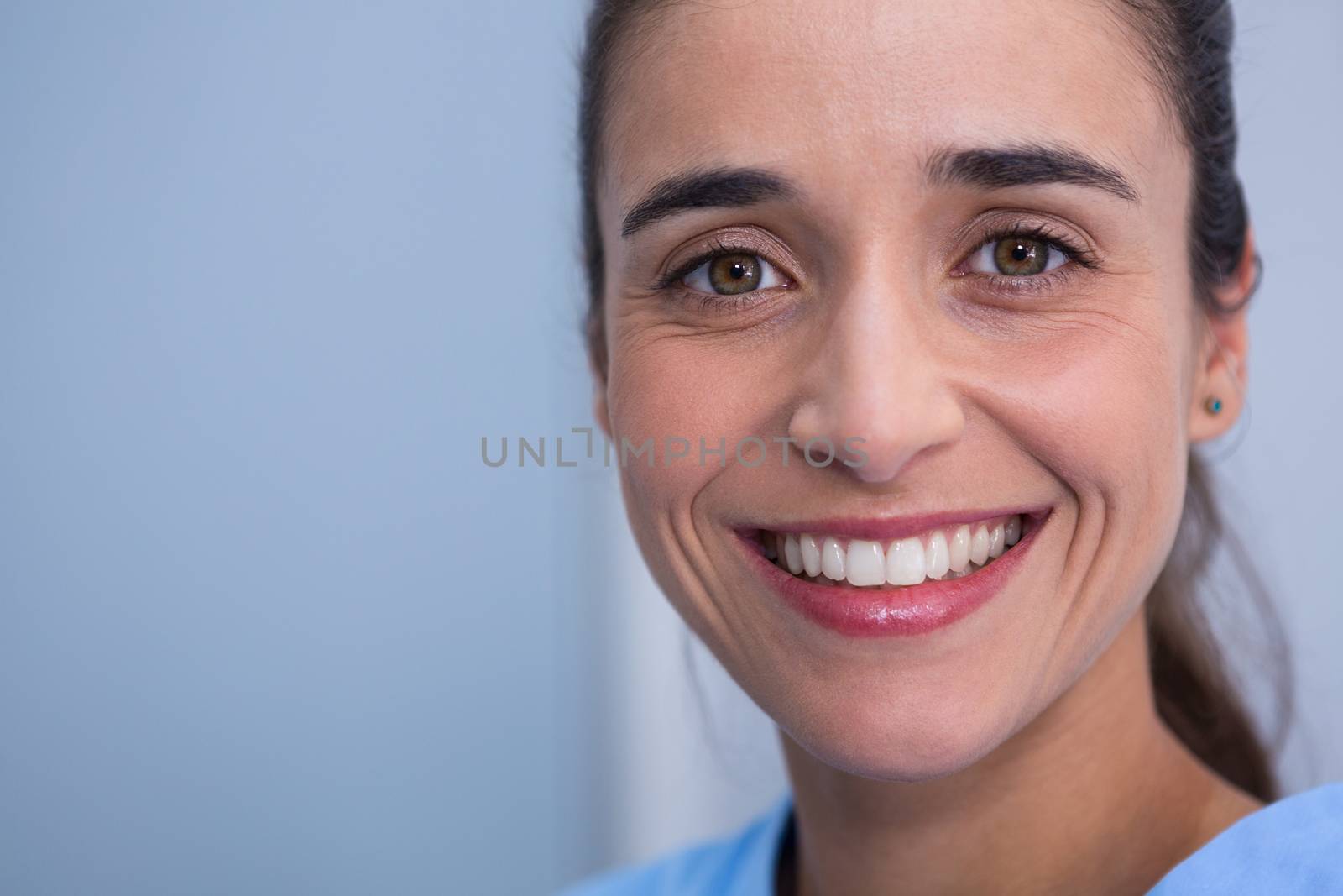 Closeup of beautiful woman smiling at dentist clinic