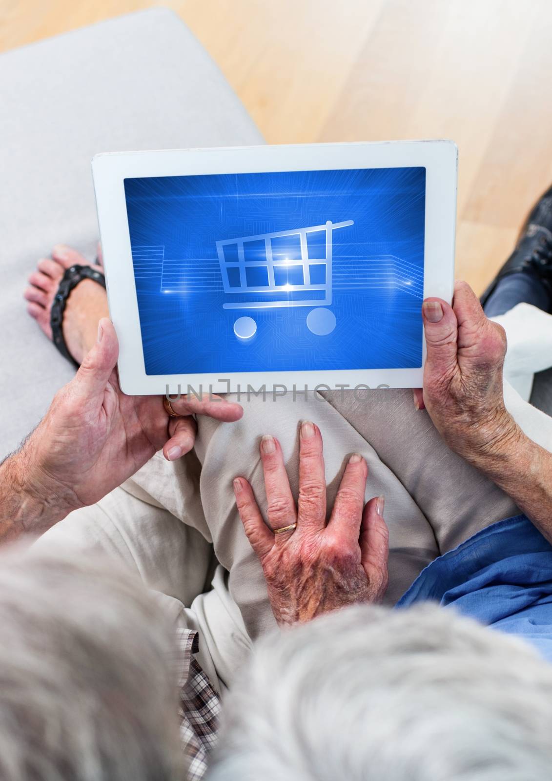 Old People using Tablet with Shopping trolley icon by Wavebreakmedia