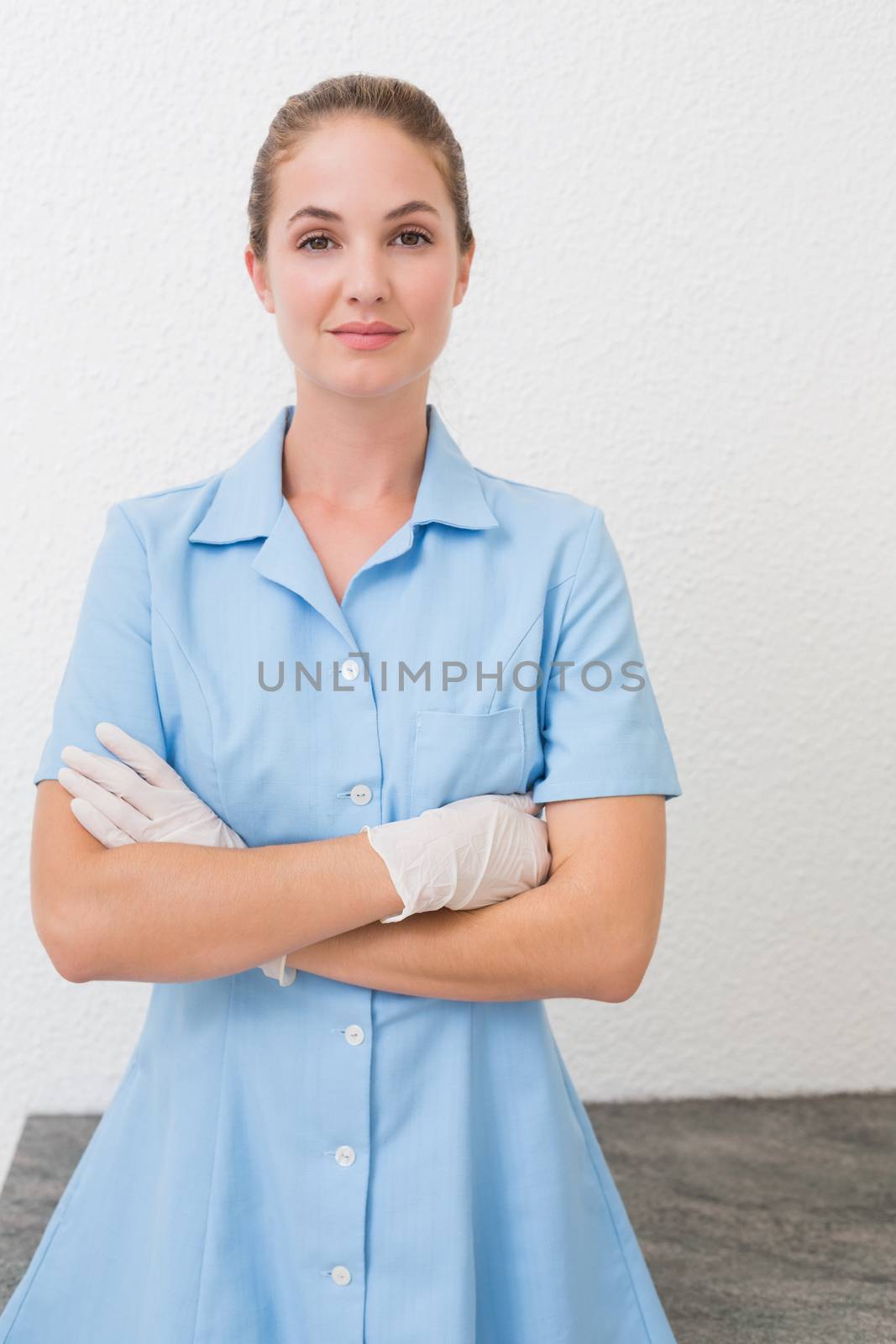 Smiling dental assistant looking at camera by Wavebreakmedia