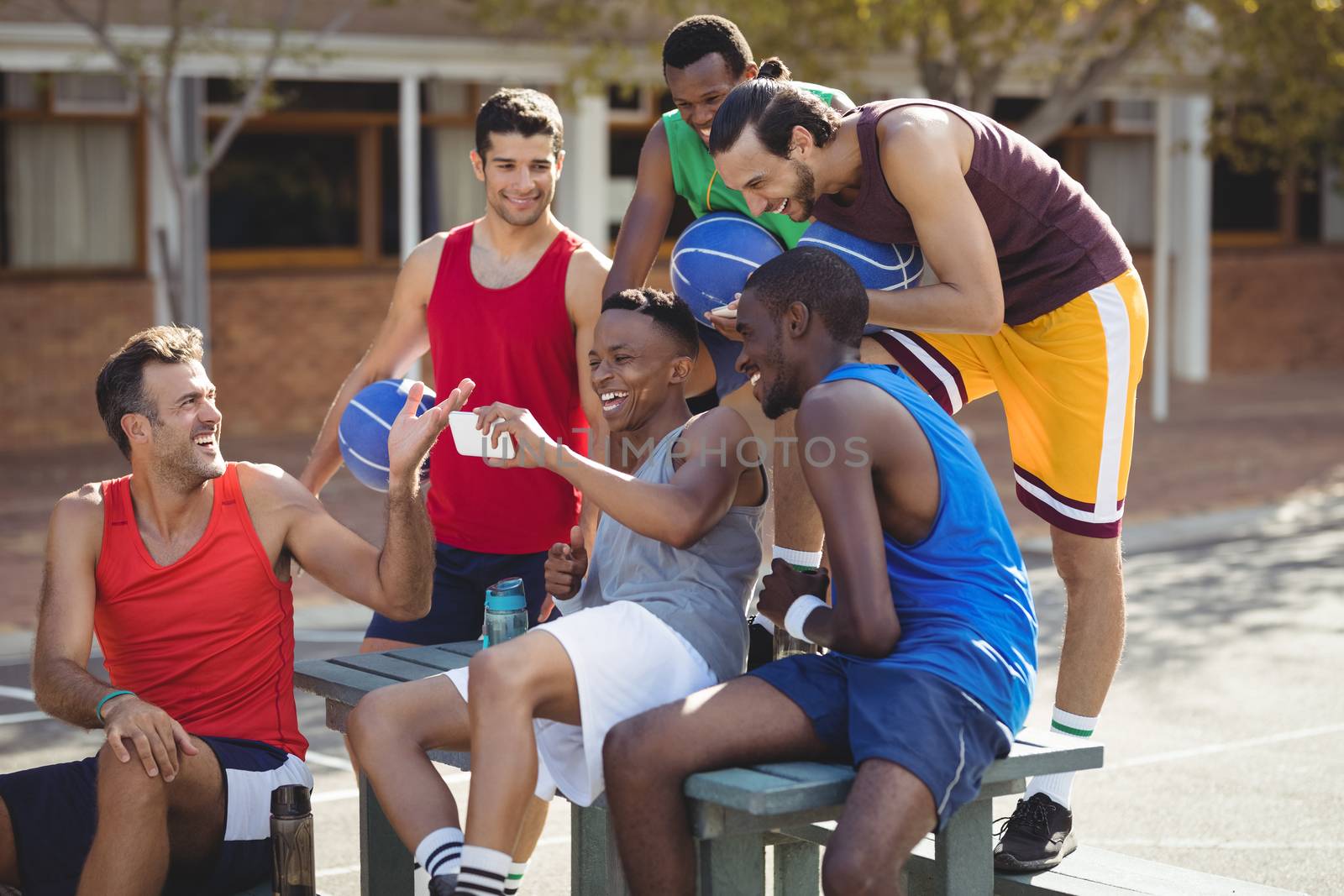 Basketball players taking a selfie by Wavebreakmedia