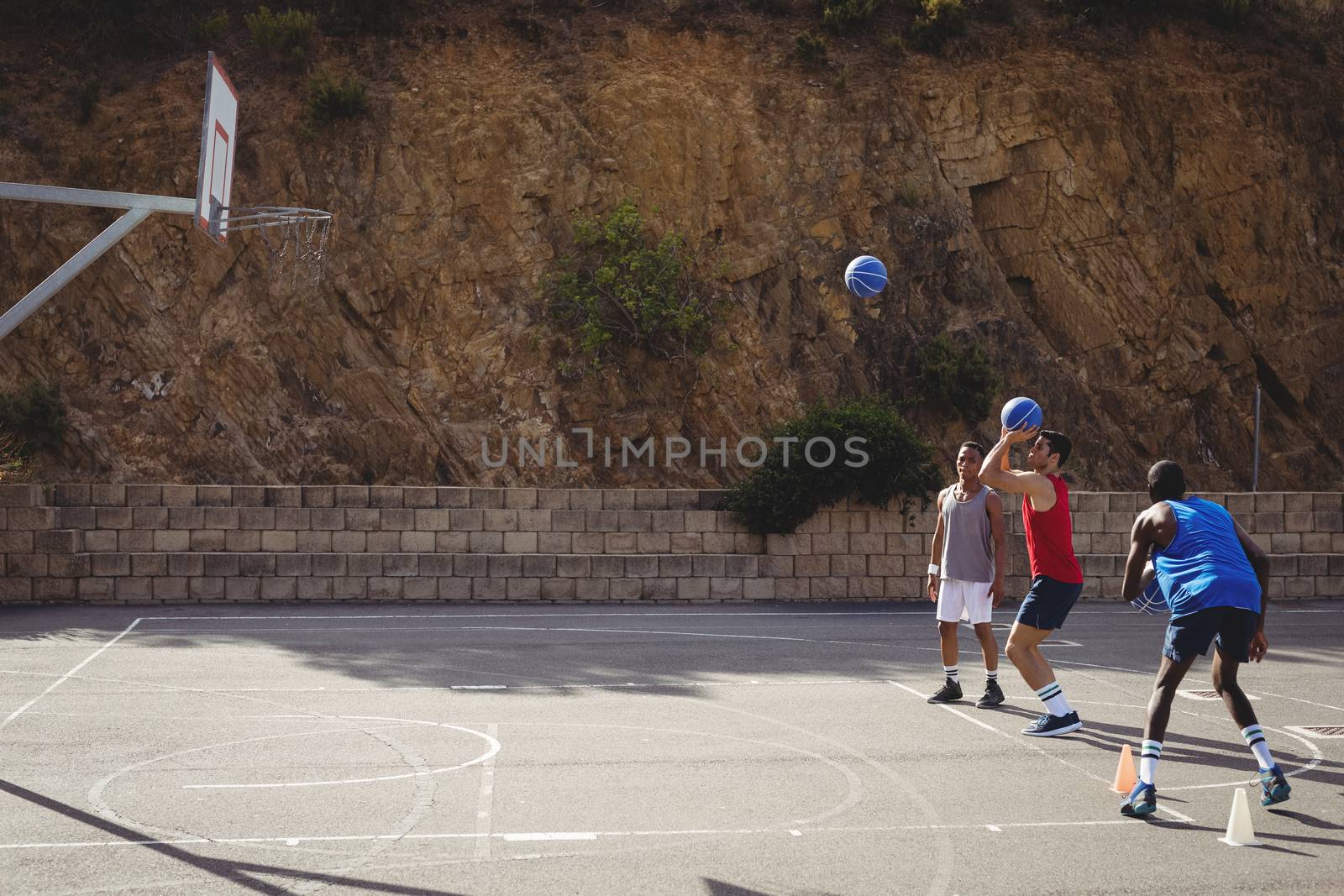 Basketball player taking a penalty shot by Wavebreakmedia