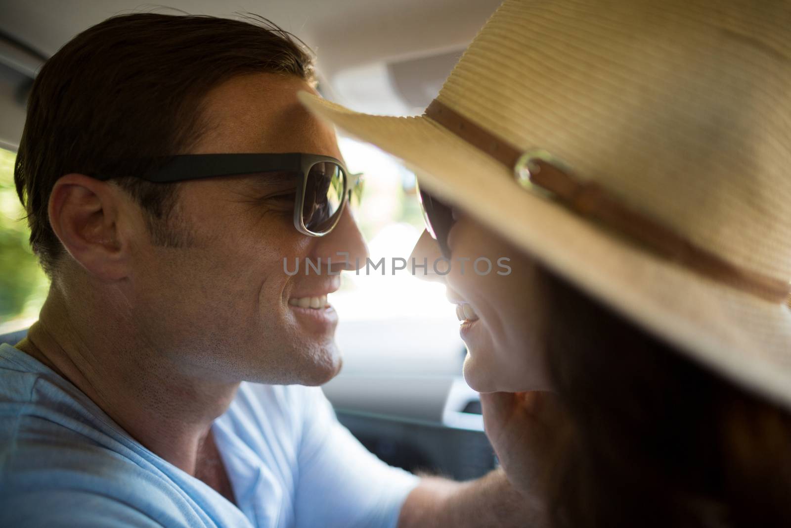 Romantic couple traveling in car by Wavebreakmedia