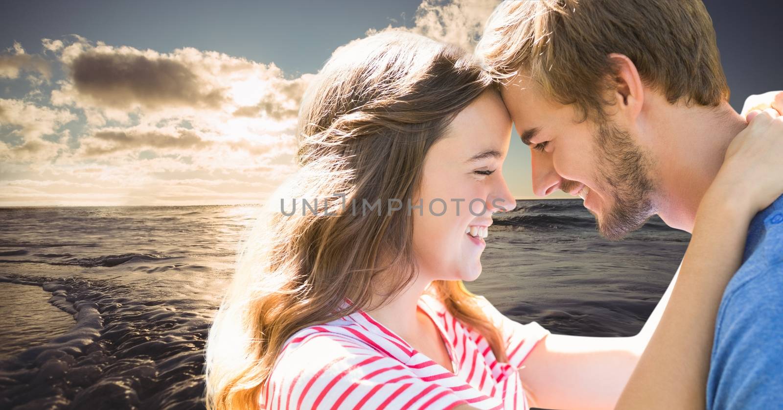 Digital composite of Romantic young couple head to head against sea