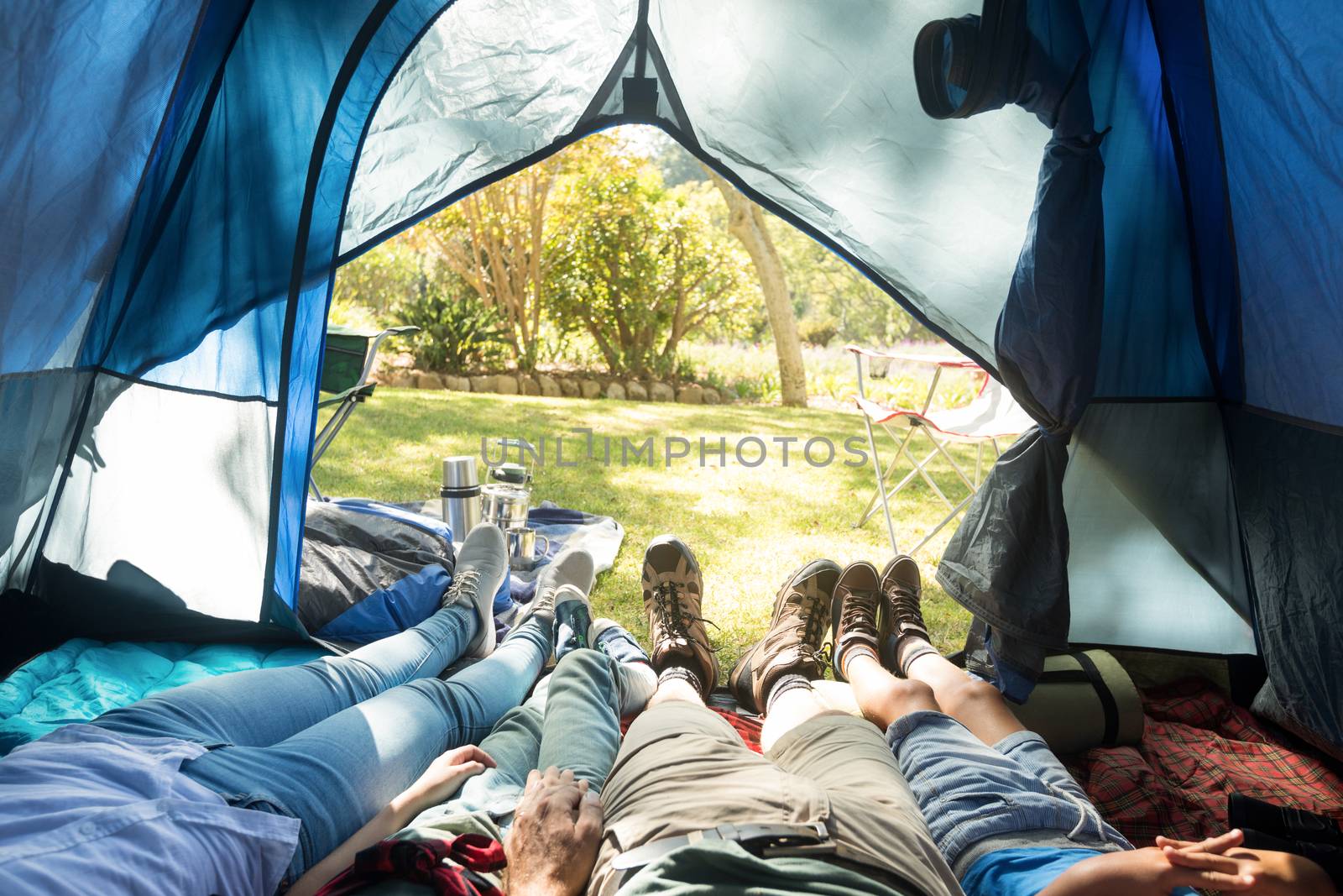 Low section of family sleeping in the tent