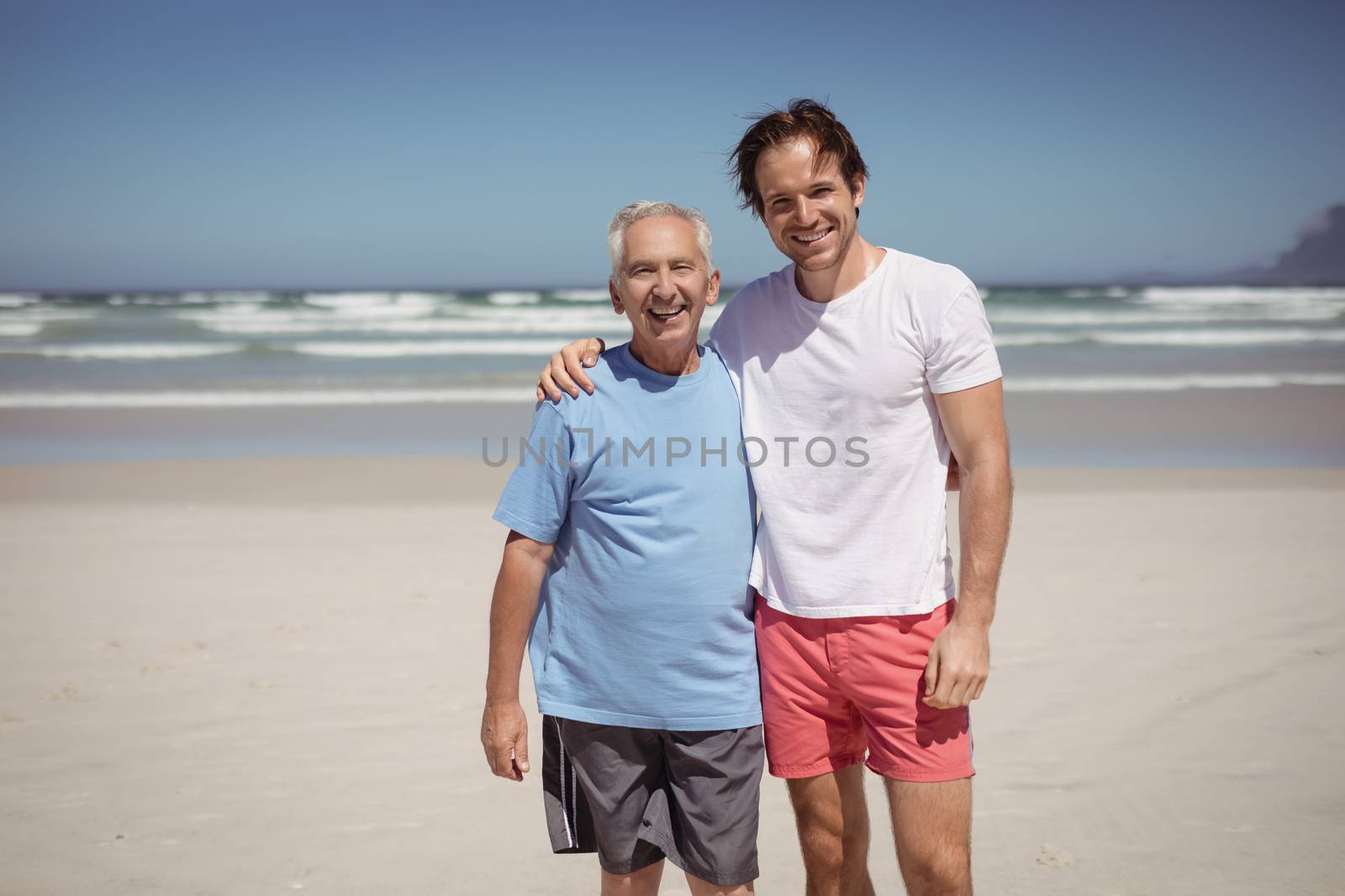Portrait of smiling family at beach by Wavebreakmedia