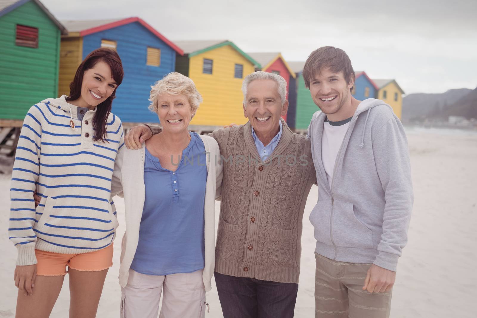 Portrait of family standing together at beach