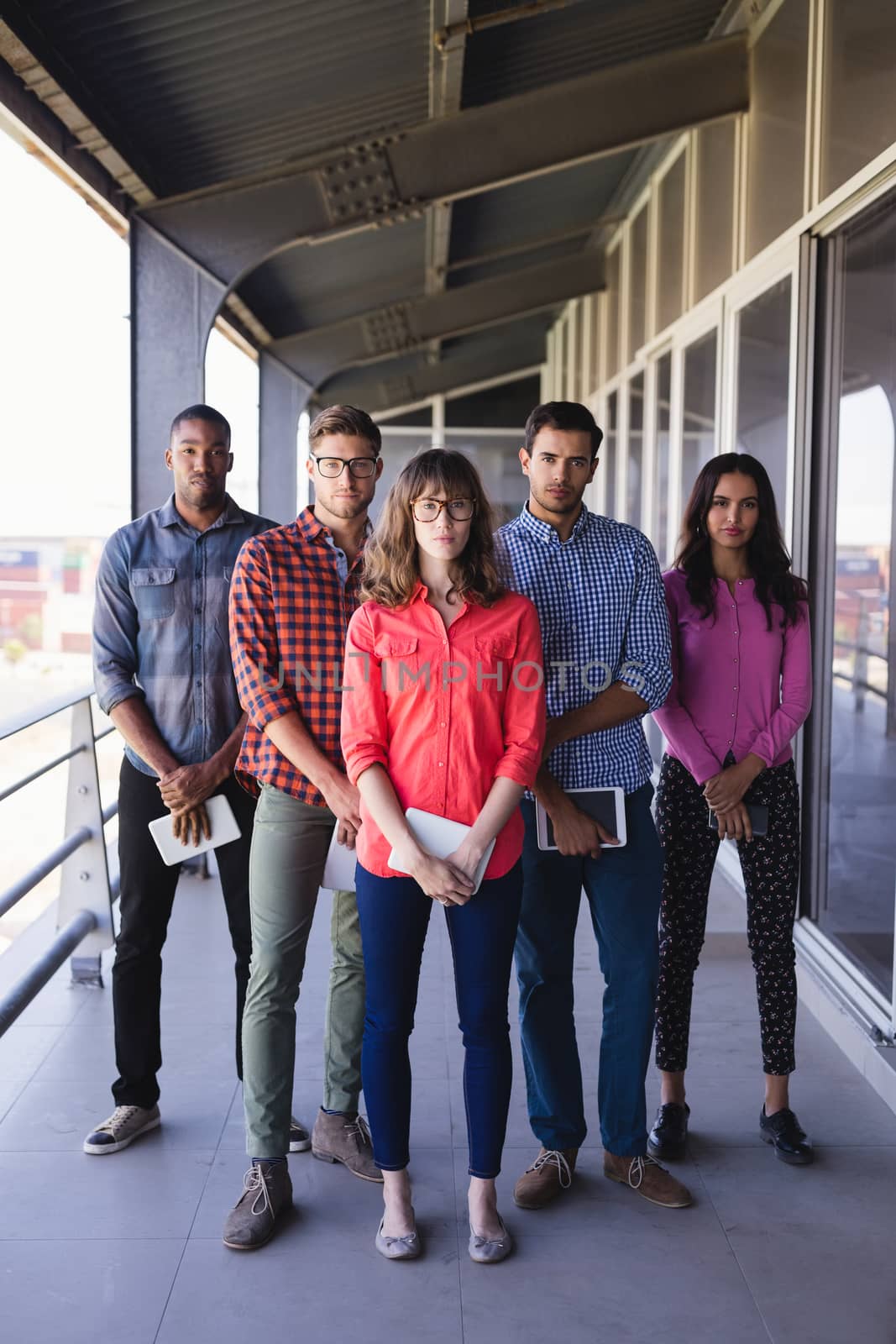 Full length portrait of business people standing in balcony