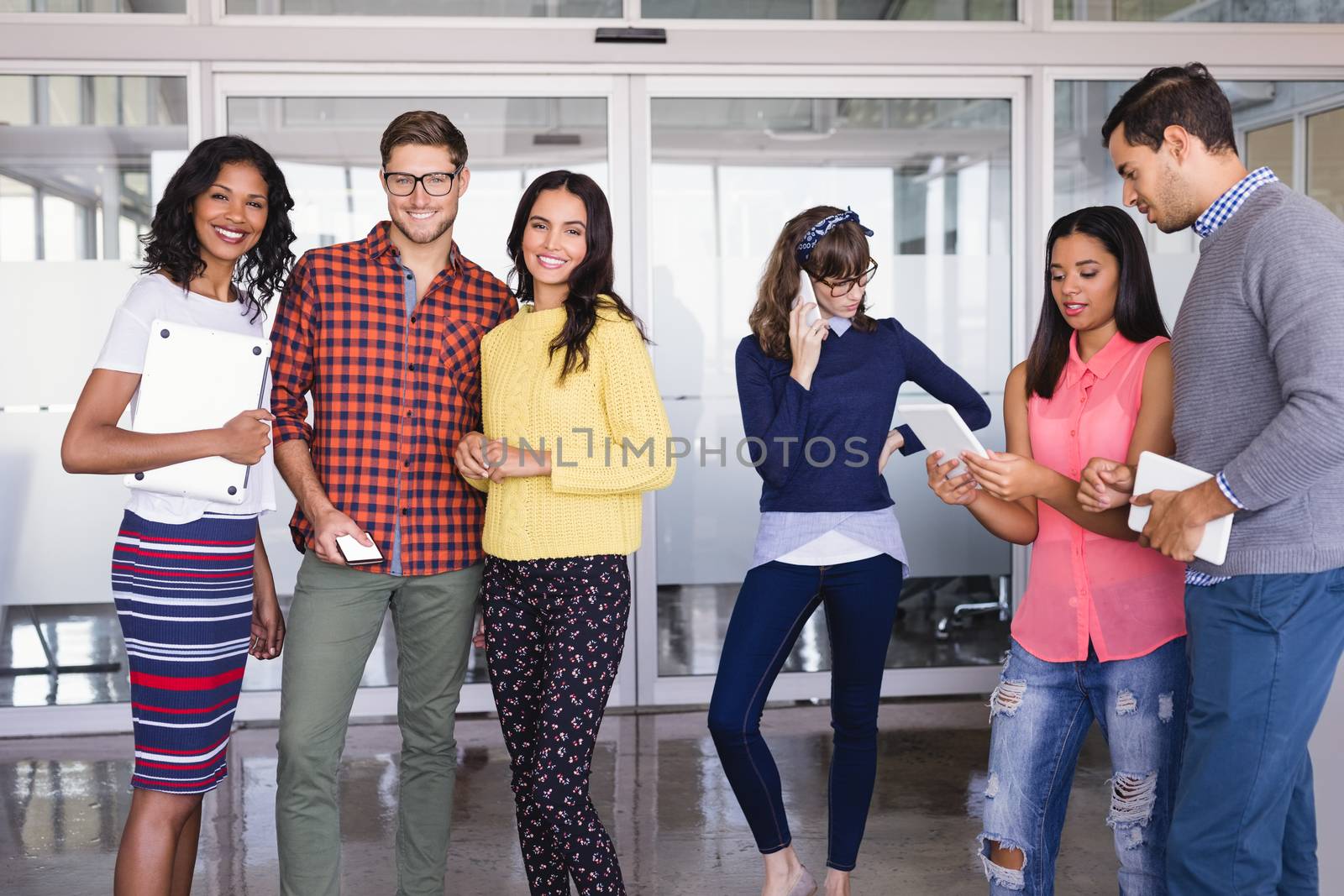 Confident business people standing in office