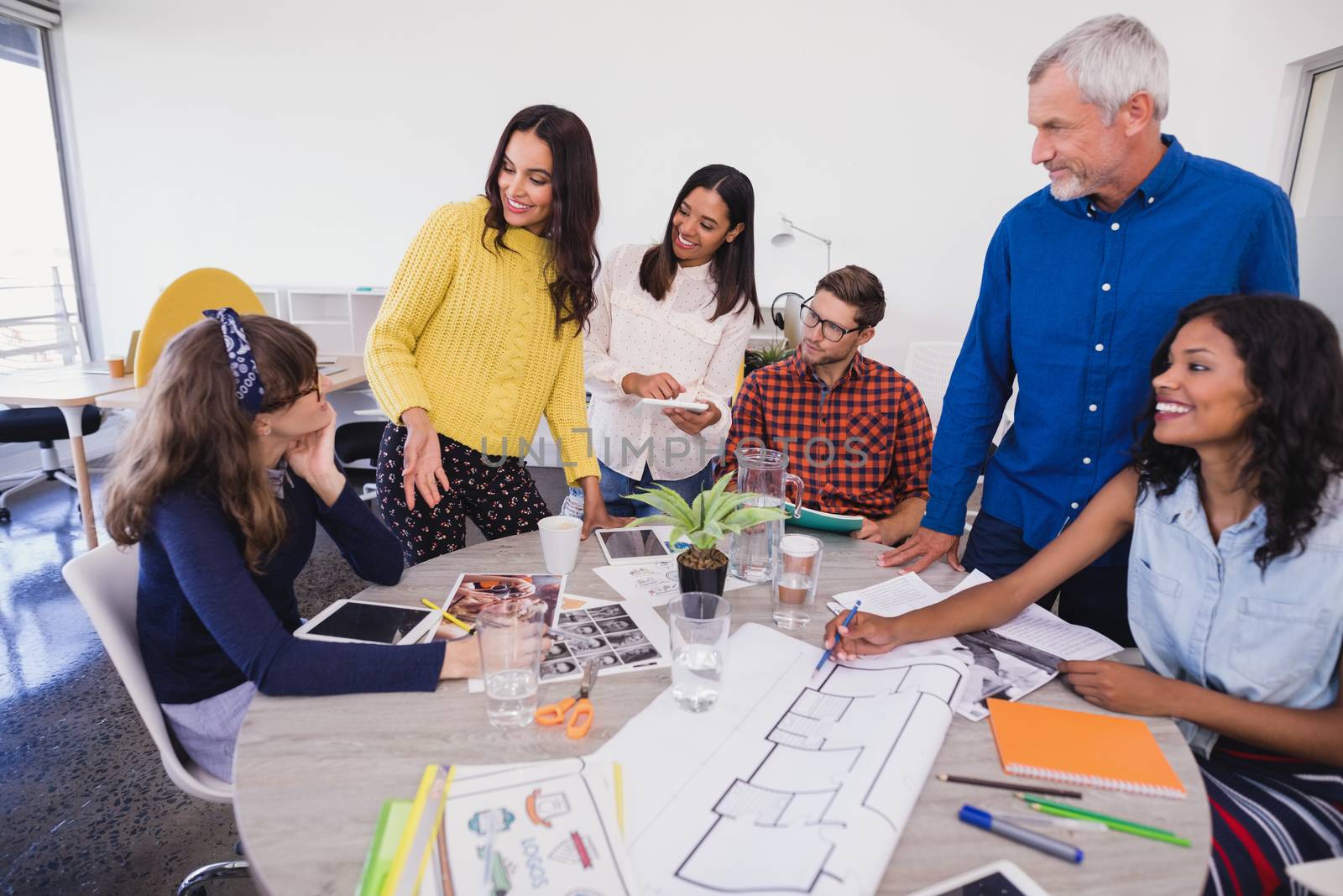 Business people discussing at desk during meeting 