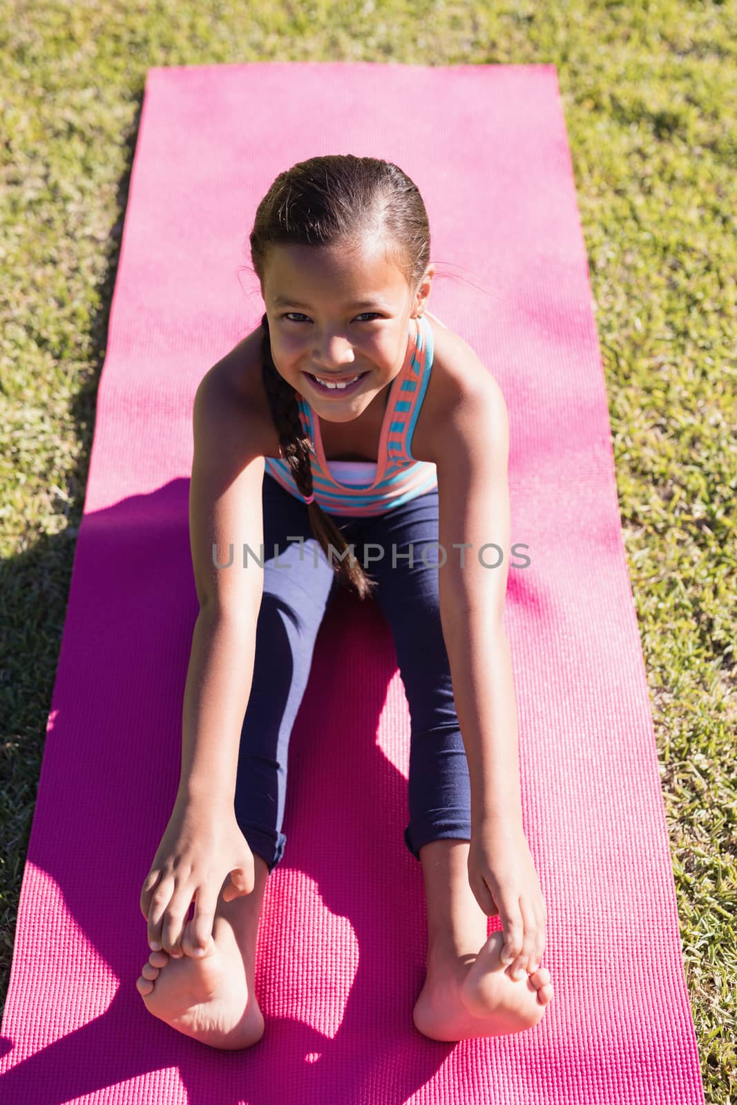 High angle portrait of girl practicing yoga by Wavebreakmedia