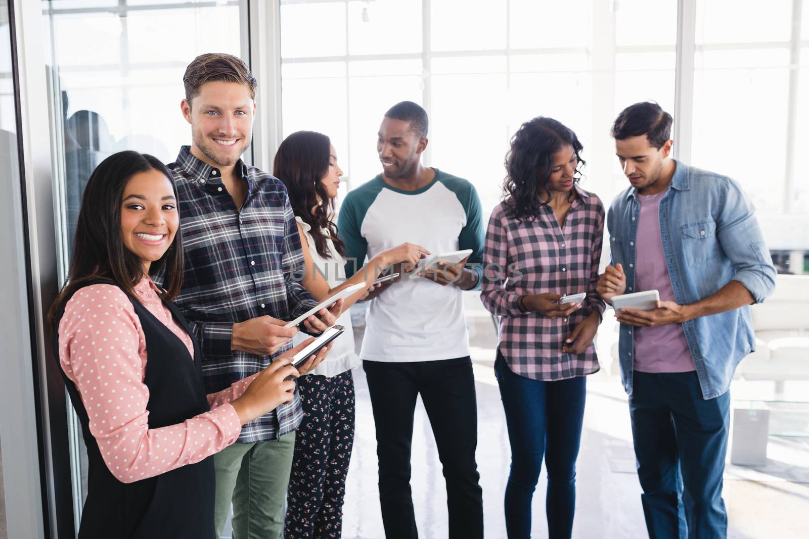 Business people standing in boardroom by Wavebreakmedia