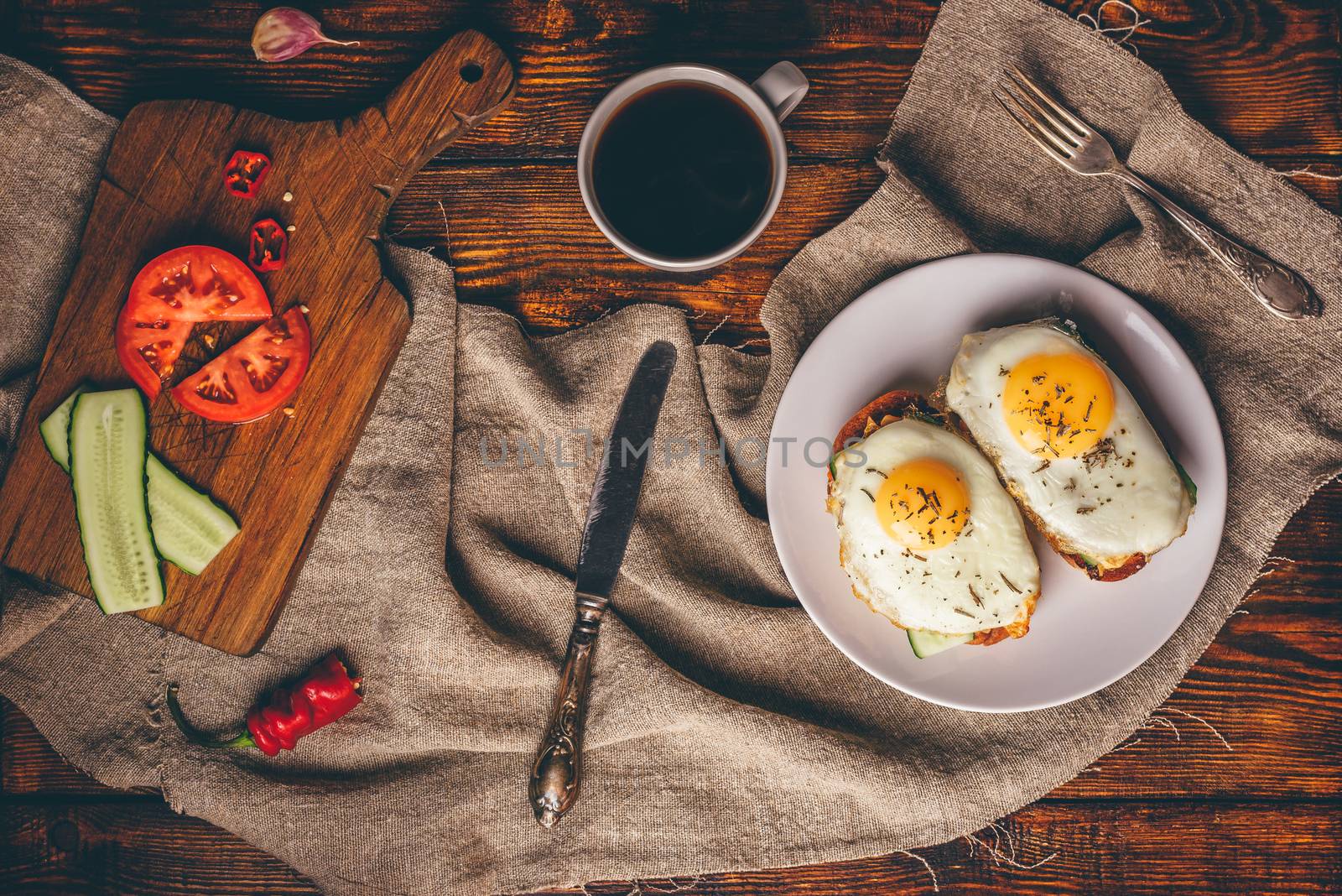 Breakfast toasts with vegetables and fried eggs with cup of coff by Seva_blsv