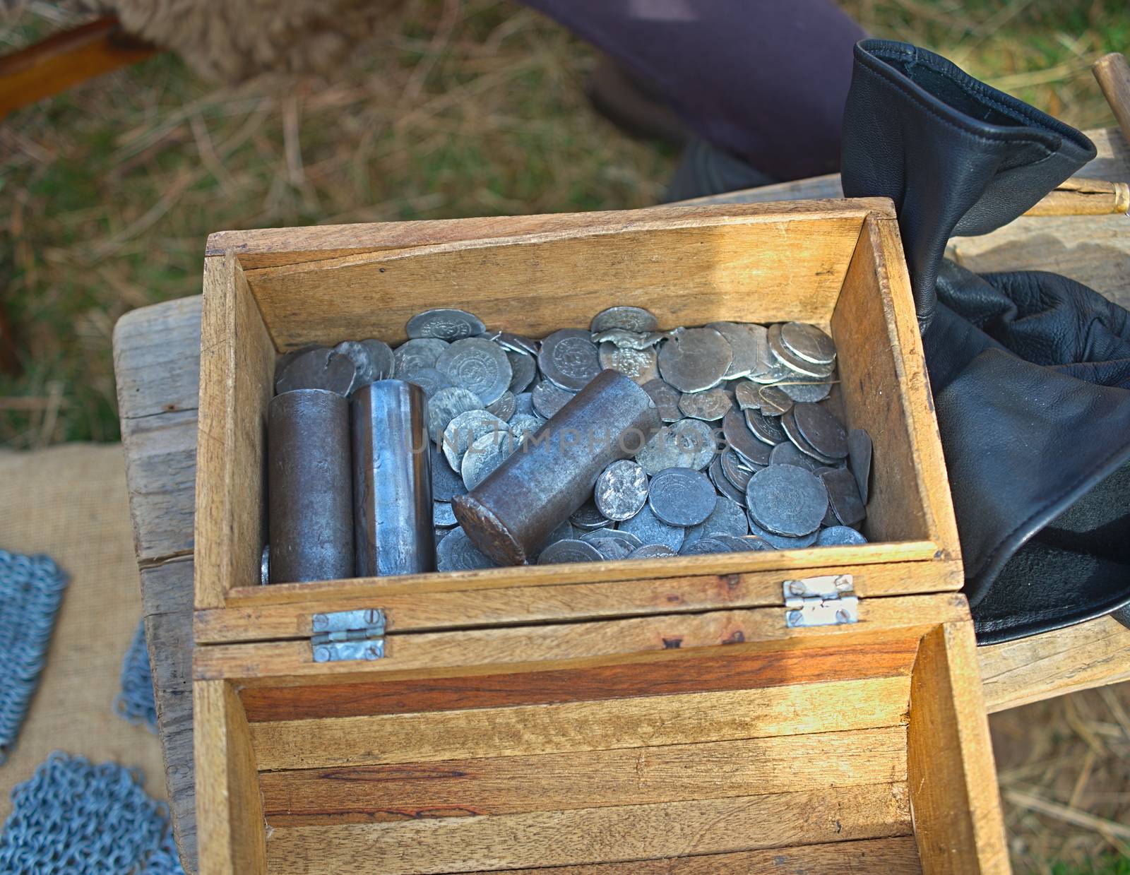 Wooden treasure chest with medieval coins by sheriffkule