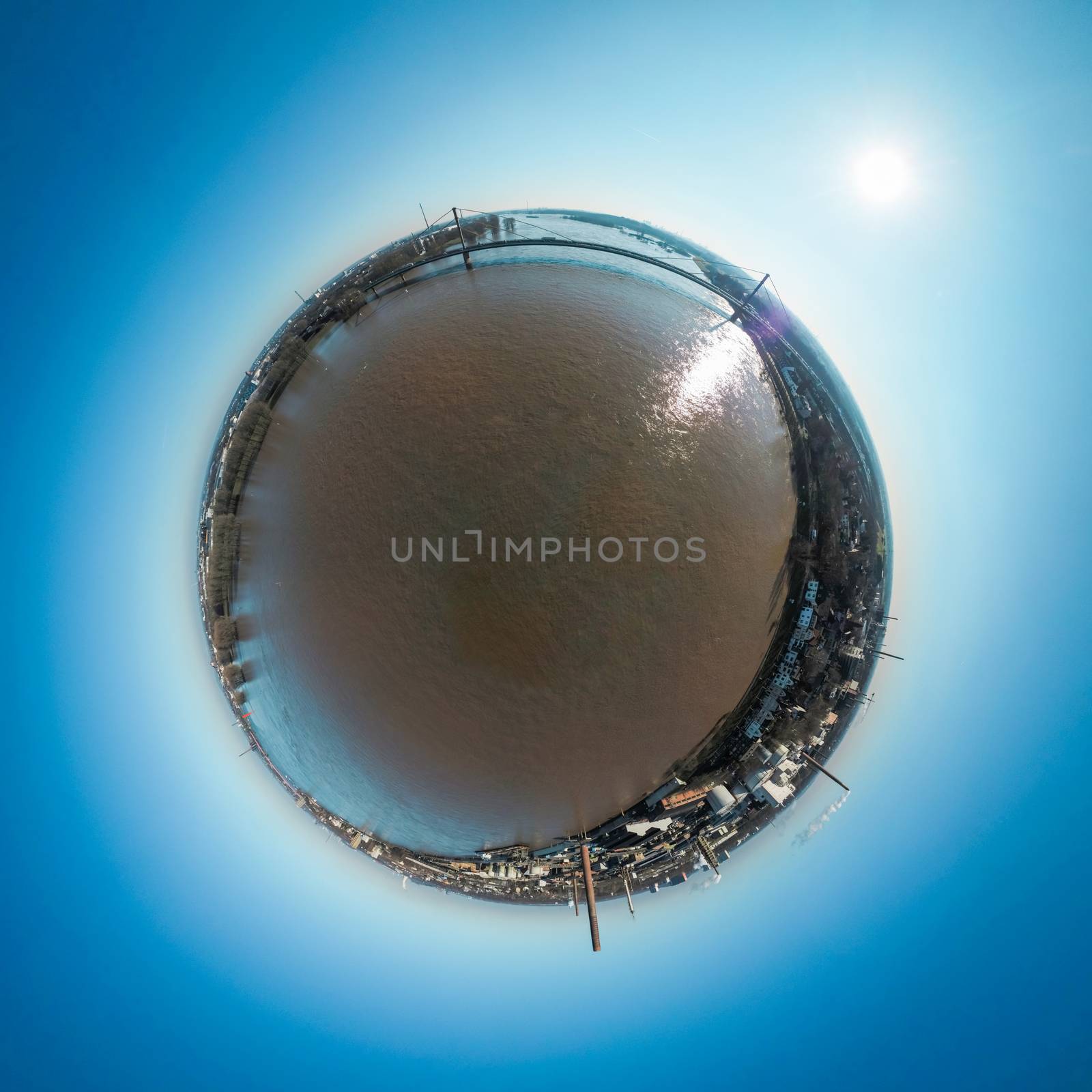 Rhine during flood next to bridge of highway A40 in Duisburg Neuenkamp Germany, little planet optic