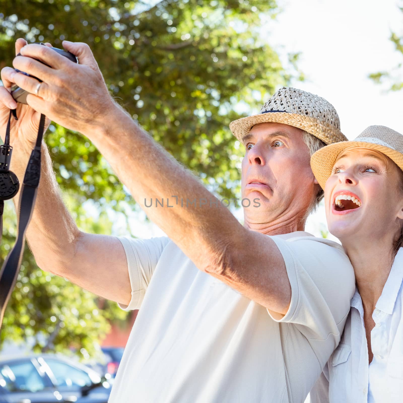 Happy senior couple posing for a selfie by Wavebreakmedia