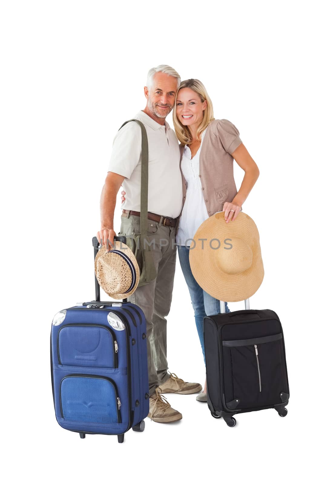 Happy couple ready to go on holiday on white background