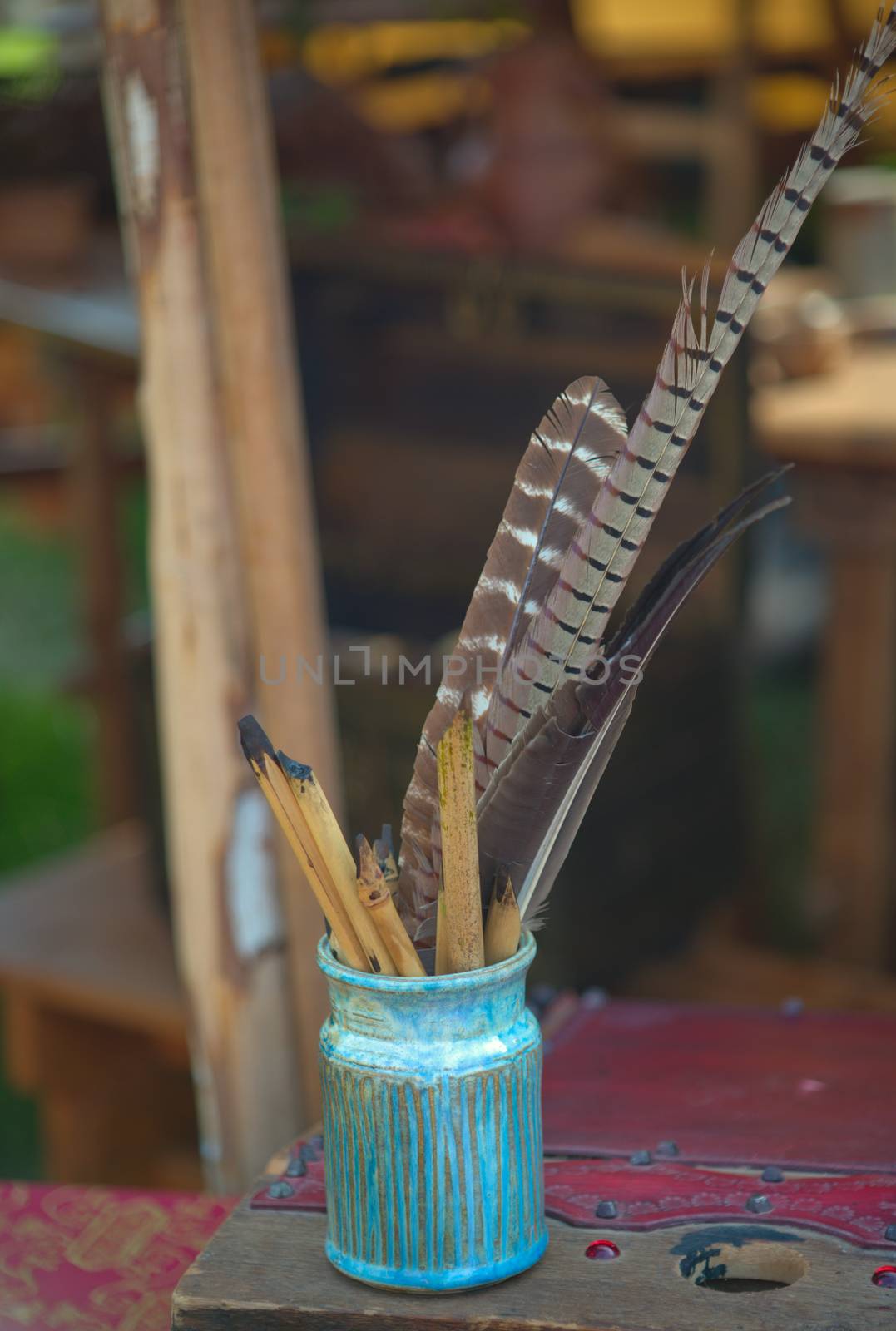 Small vase full with tools for medieval clerk