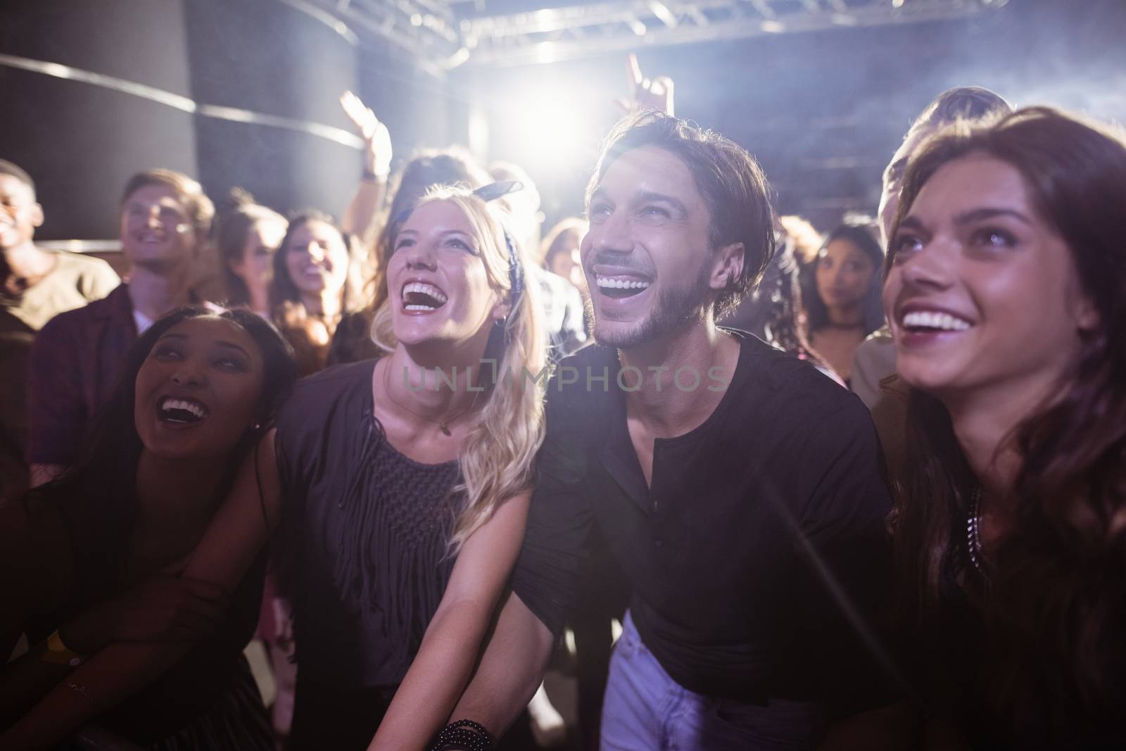 Cheerful people enjoying at nightclub by Wavebreakmedia