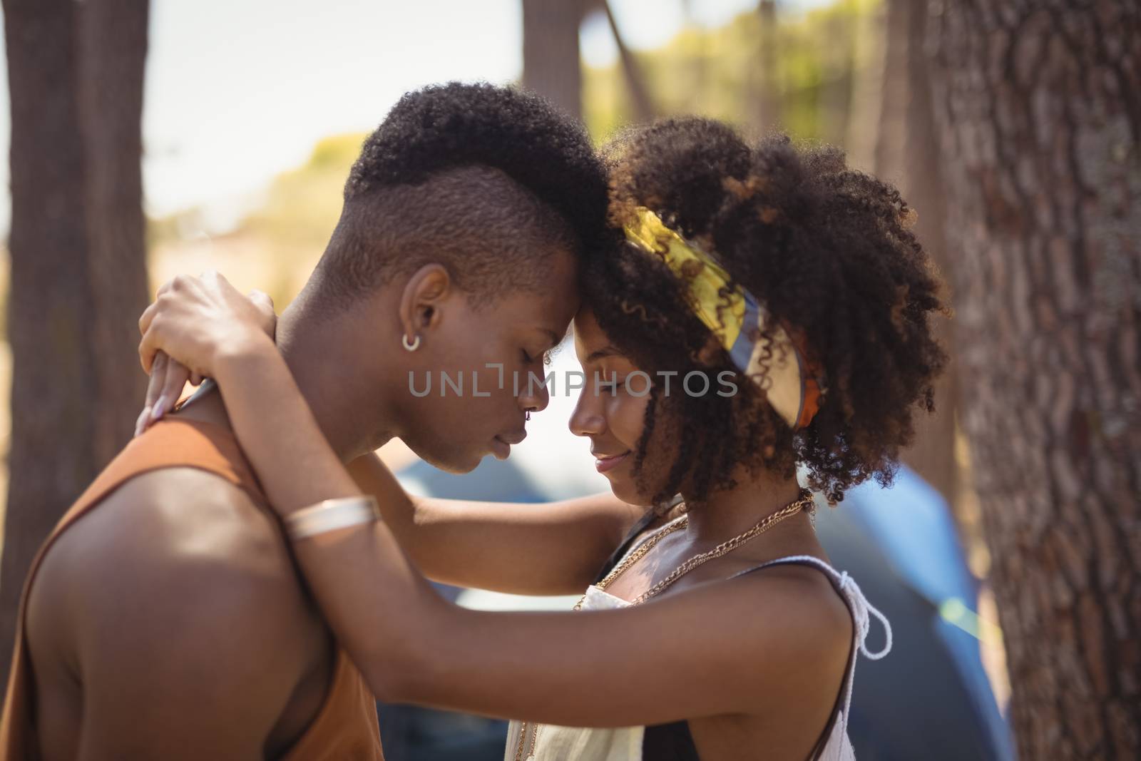 Close up of romantic couple standing against tent by Wavebreakmedia