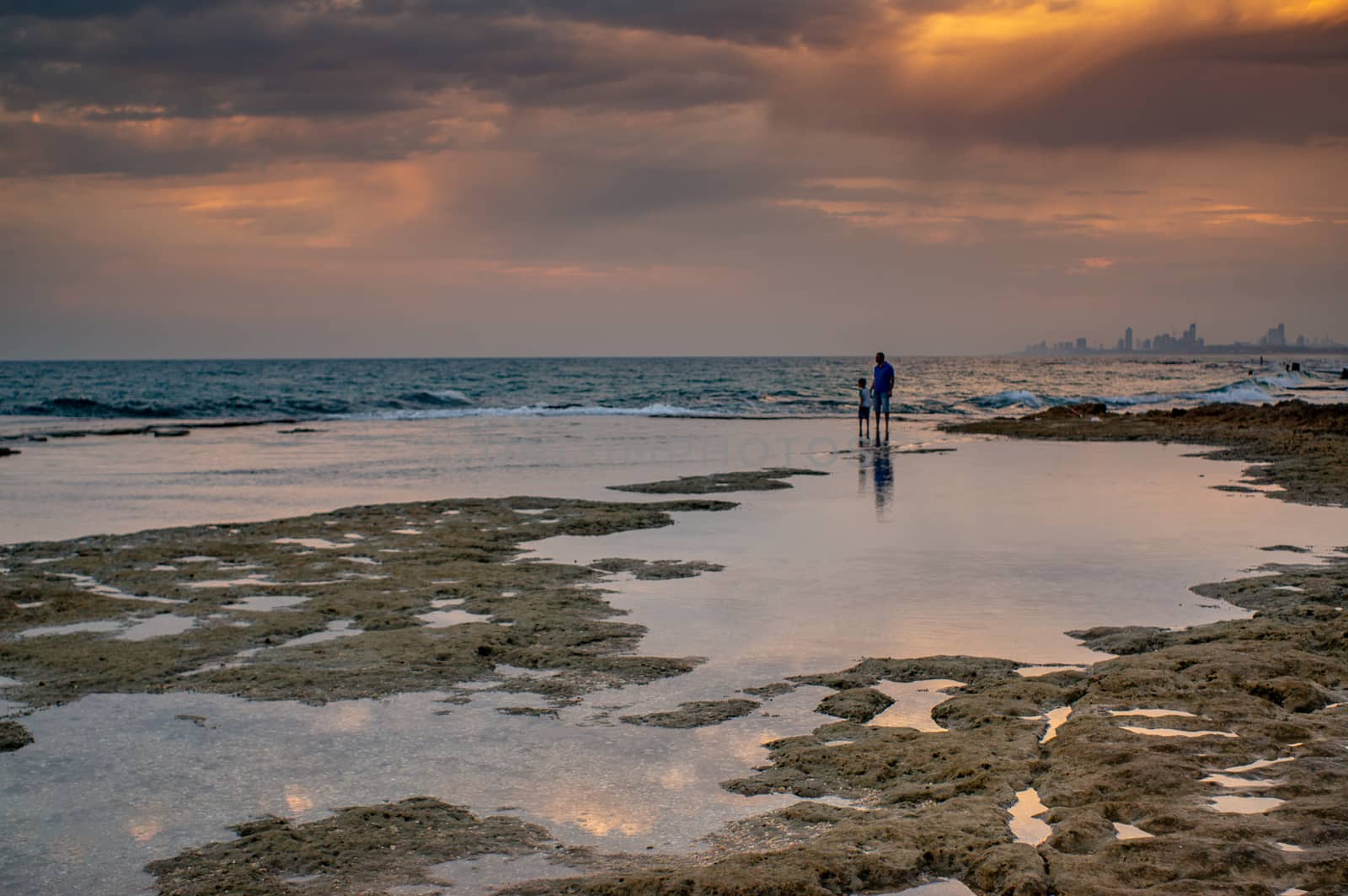 Dramatic clouds under water and windy weather sunset