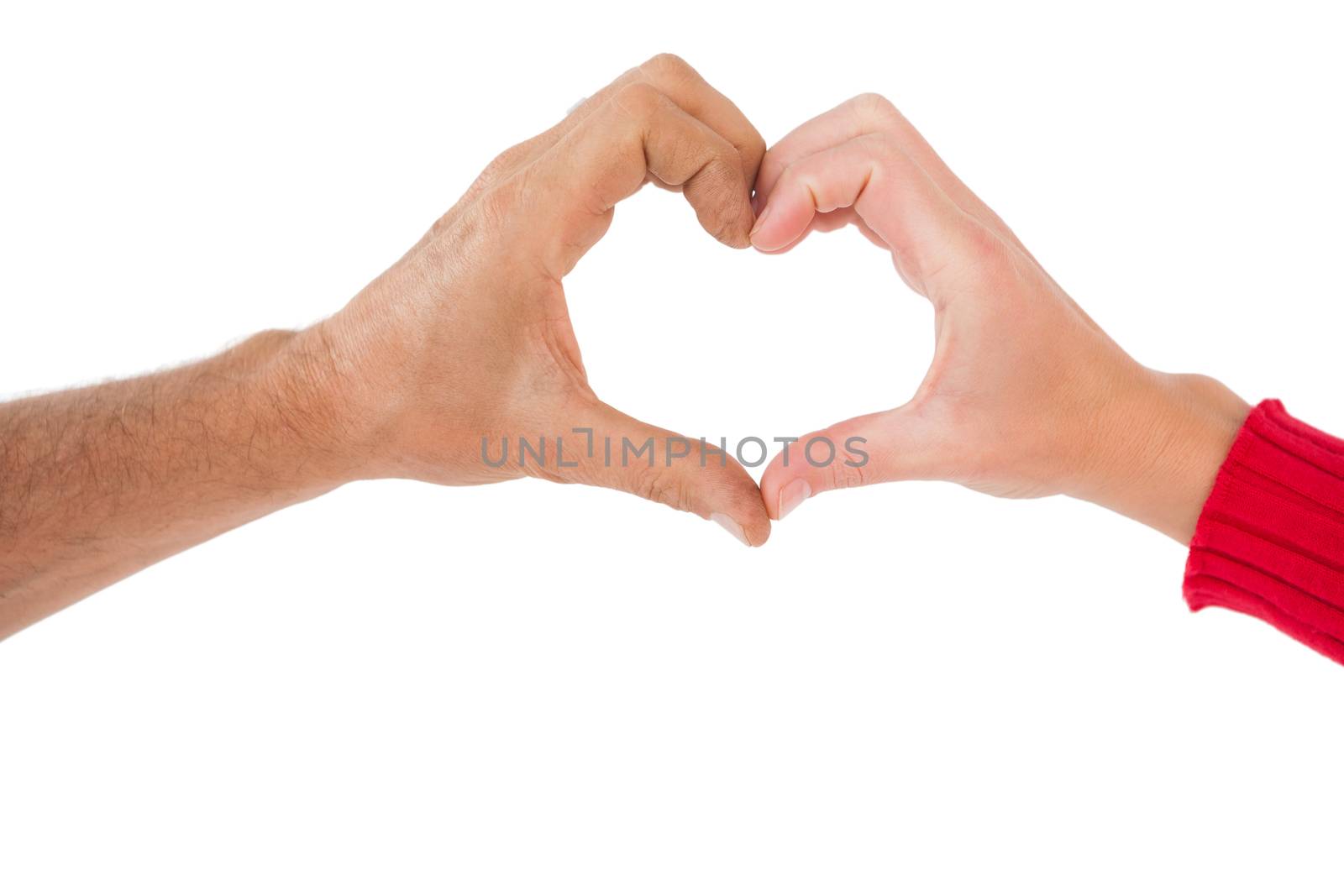 Couple making heart shape with hands by Wavebreakmedia