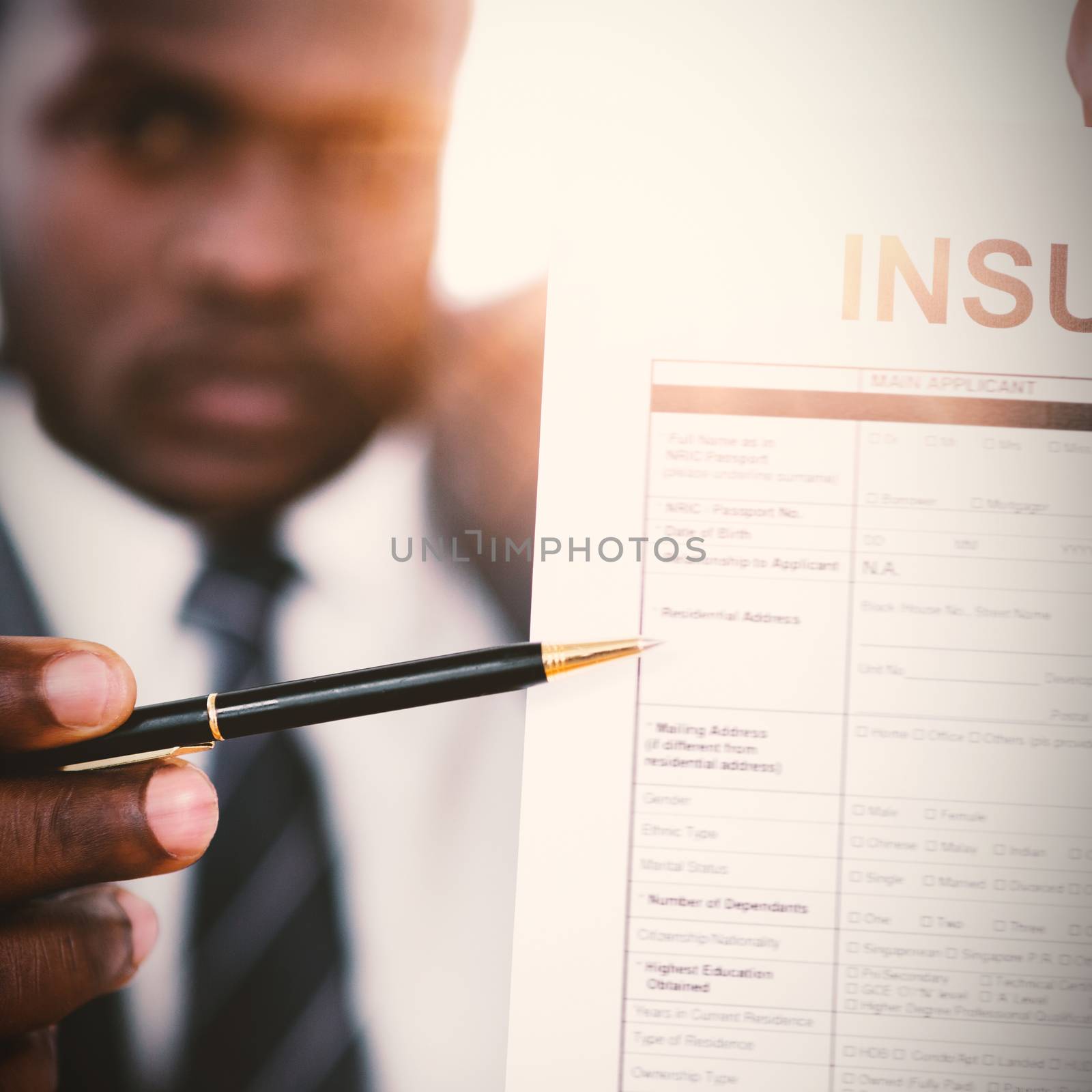 Businessman showing insurance document by Wavebreakmedia