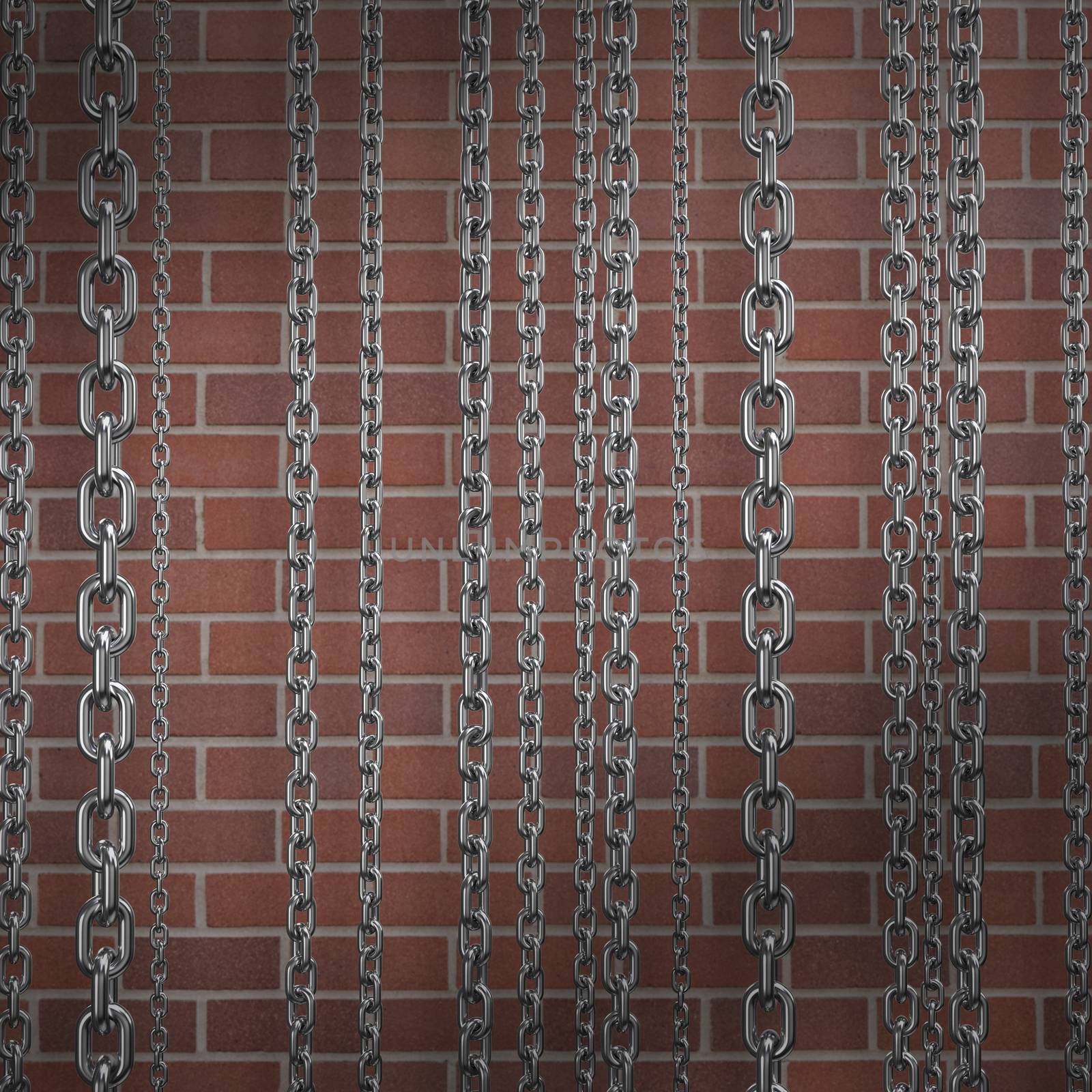 Row of silver metallic chains  against full frame shot of wall