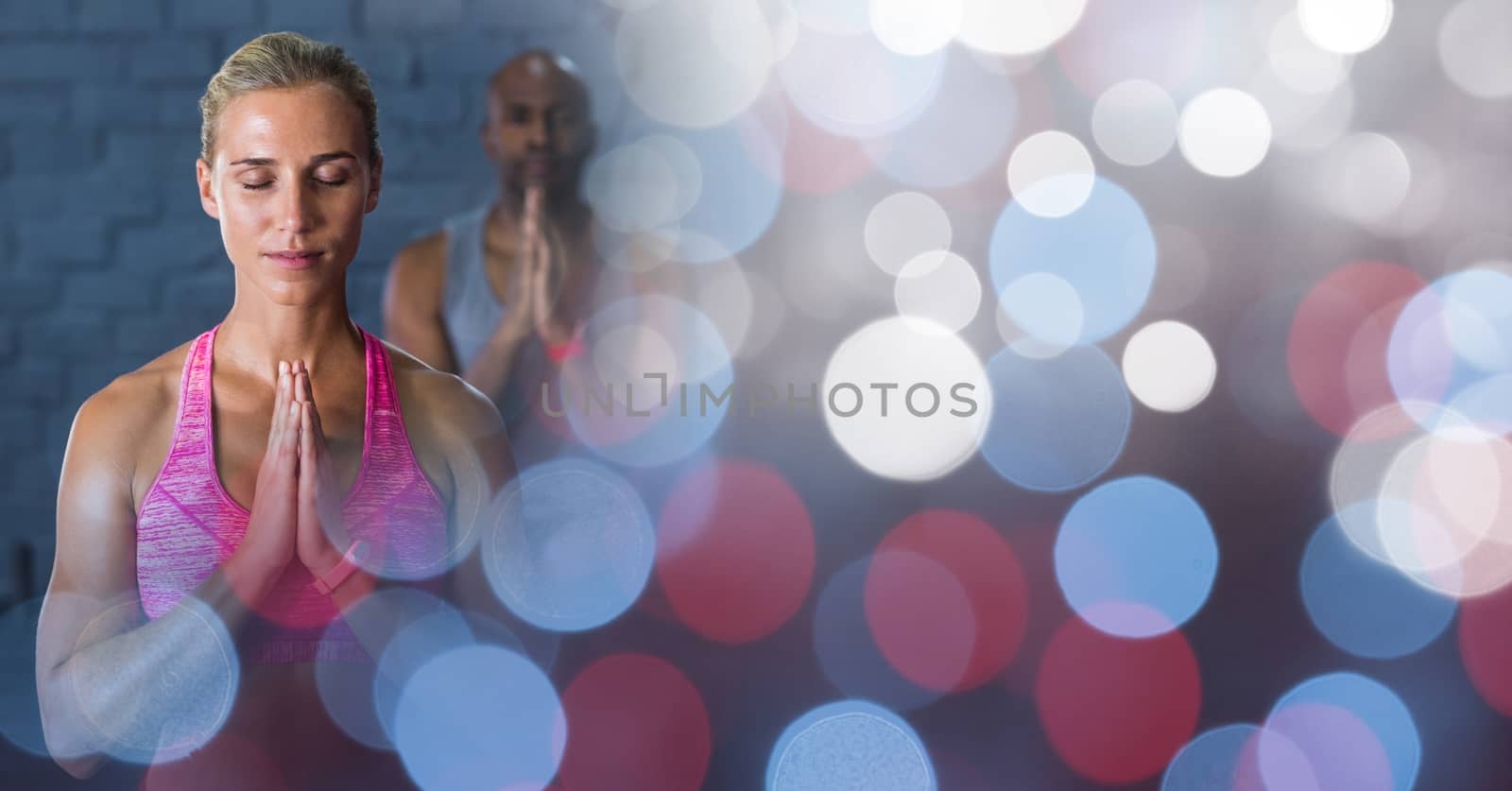 Digital composite of Woman doing yoga in gym and red blue bokeh transition