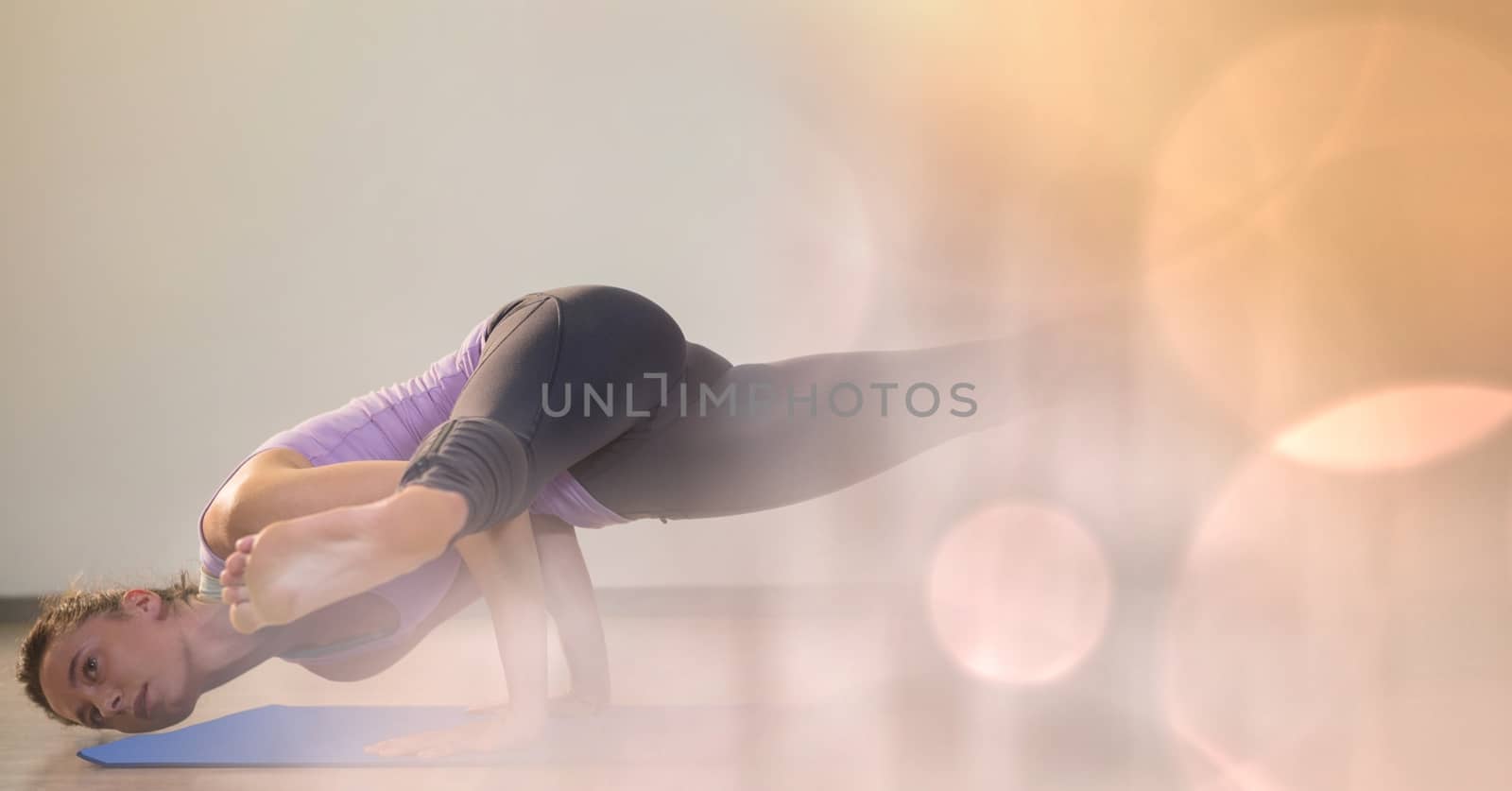 Digital composite of Athlete exercising on yoga mat