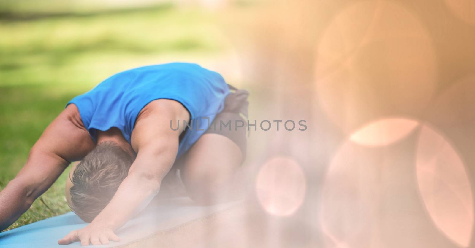 Digital composite of Man performing yoga in park