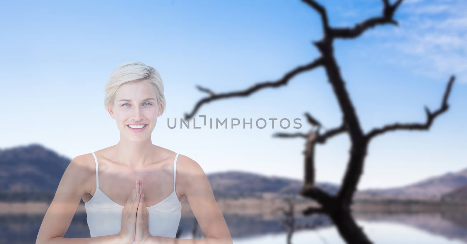 Digital composite of Double exposure of woman with hands clasped performing yoga