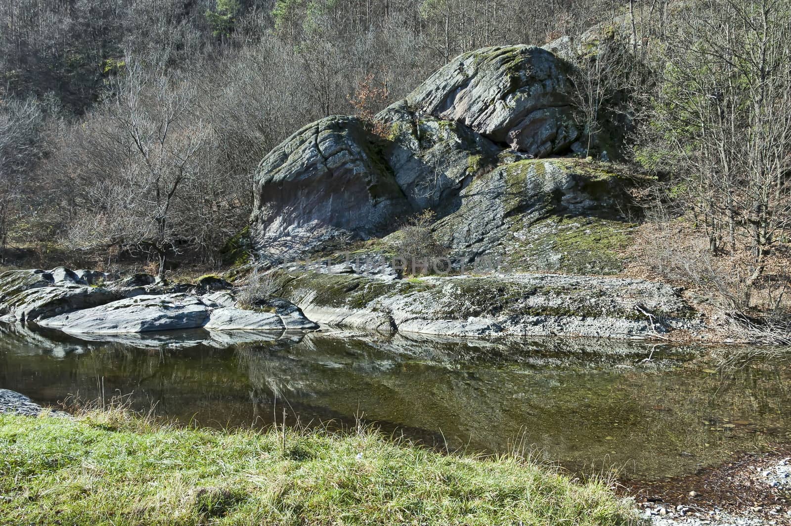 Magnificent landscape with mountain river flowing near  autumn forest, big rocks and stones, Teteven town, Bulgaria, Europe