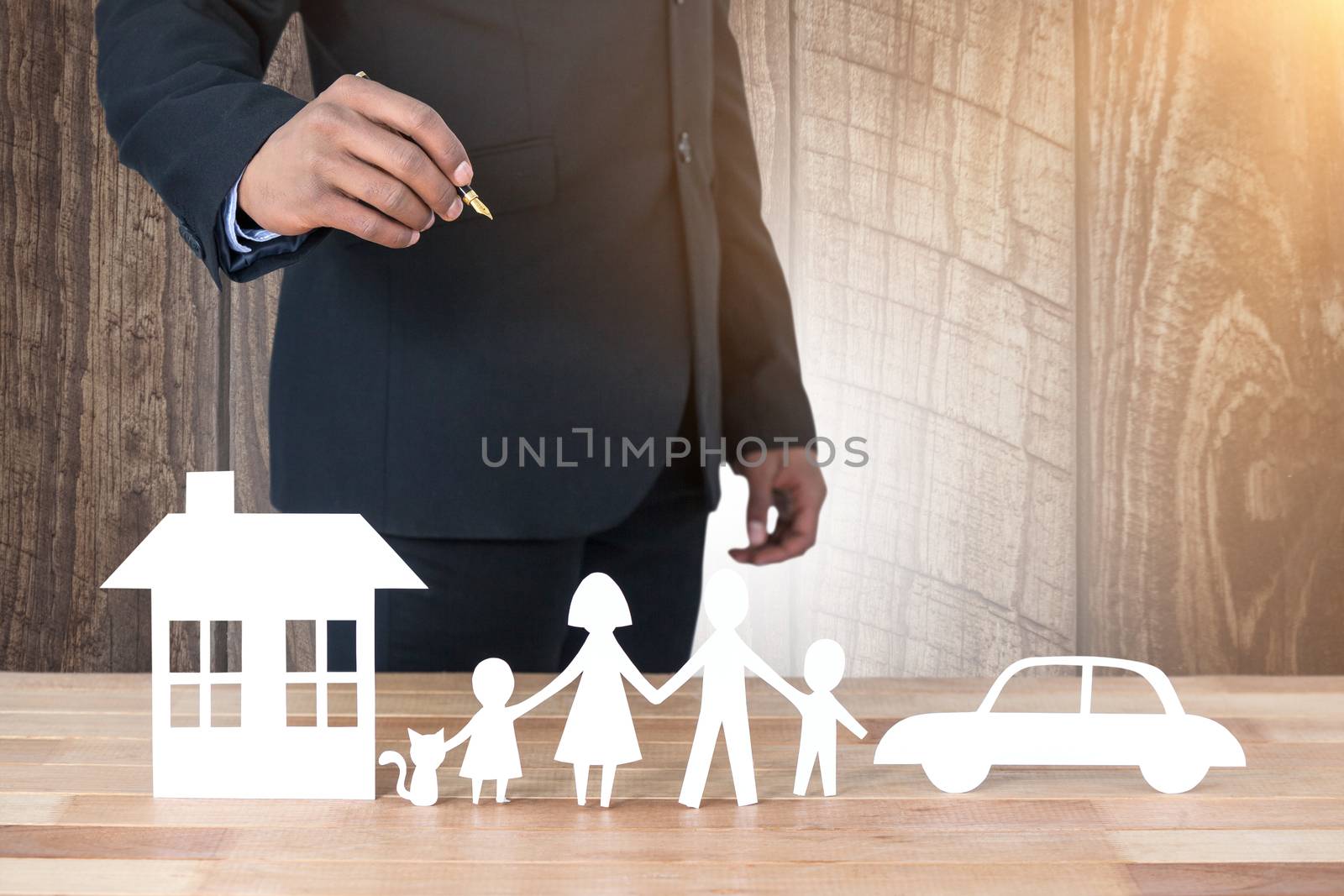 underwriter drawing a family against wood panelling