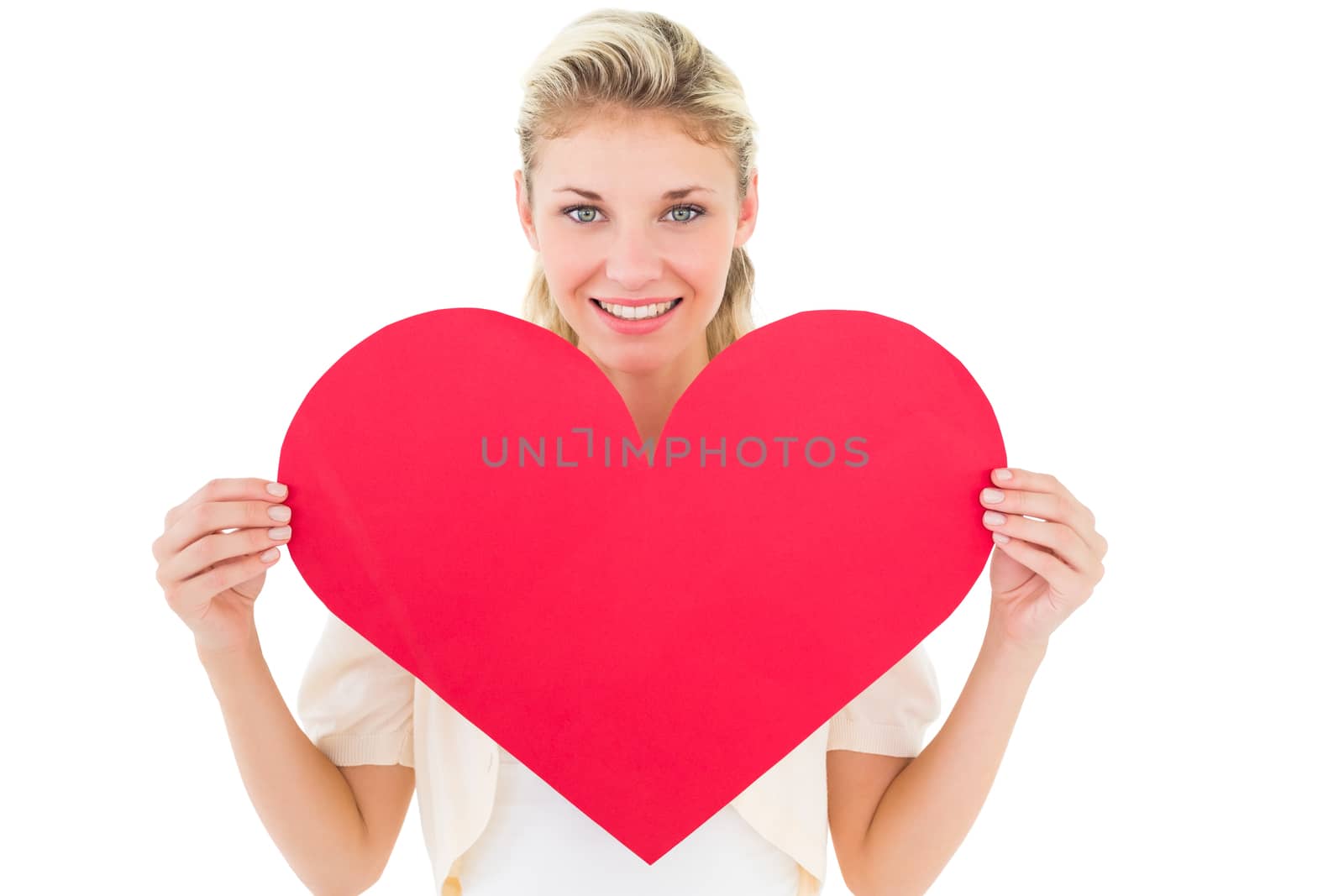 Attractive young blonde showing red heart on white background