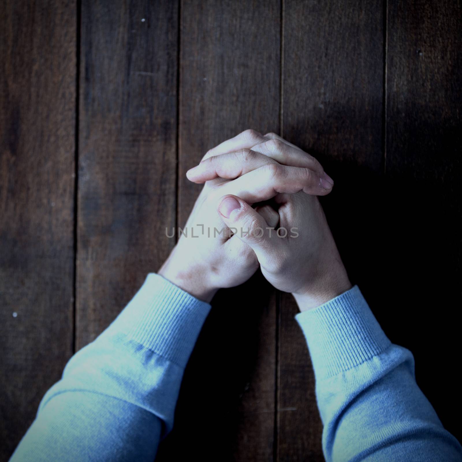 Cropped image of man praying by Wavebreakmedia