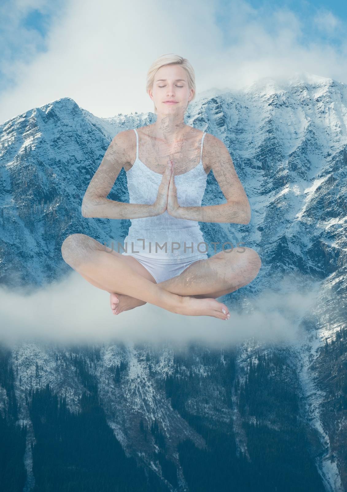 Digital composite of Woman doing yoga in front of snow-covered mountains