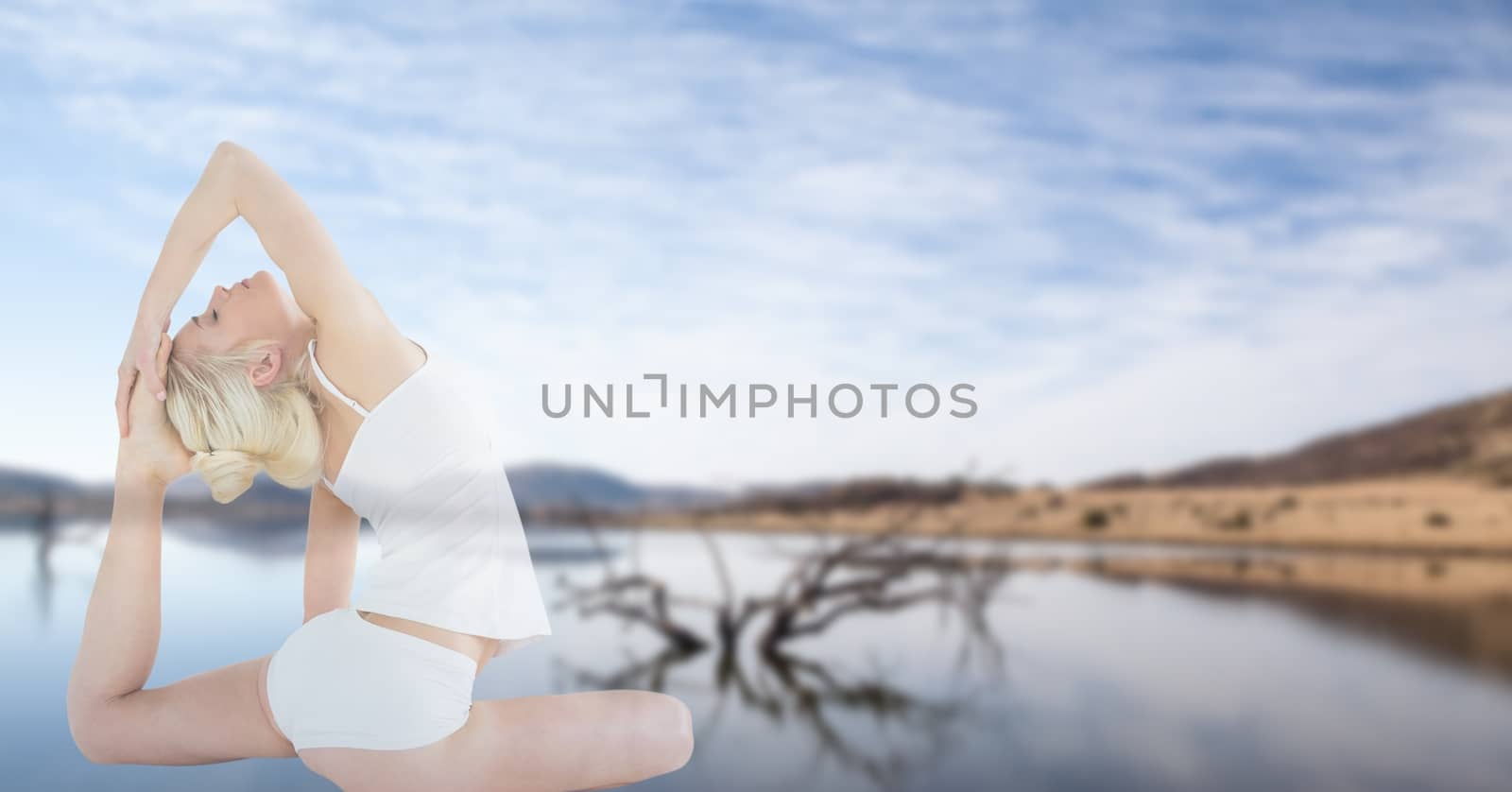 Digital composite of Double exposure of beautiful woman doing yoga and lake against sky