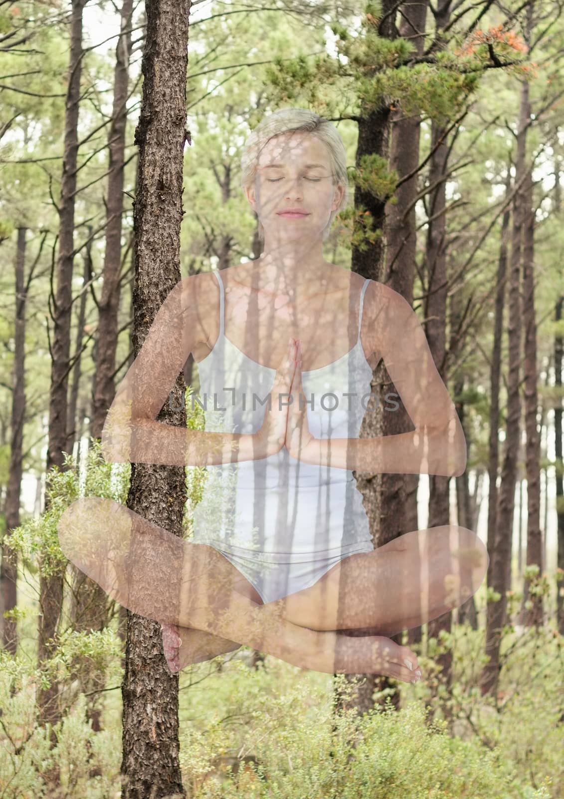 Woman doing yoga in front of wood by Wavebreakmedia