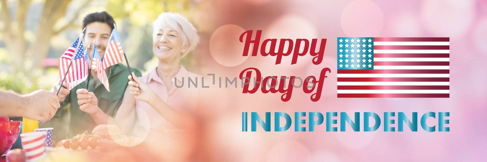 Happy independence day message over white background against happy family having a picnic