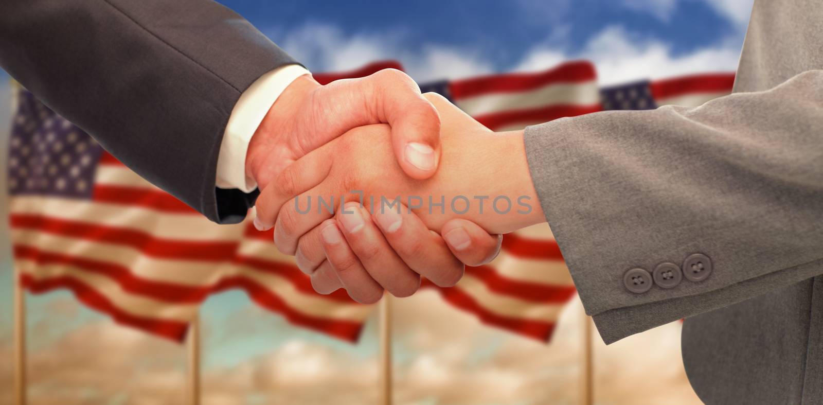 Composite image of handshake between two business people by Wavebreakmedia