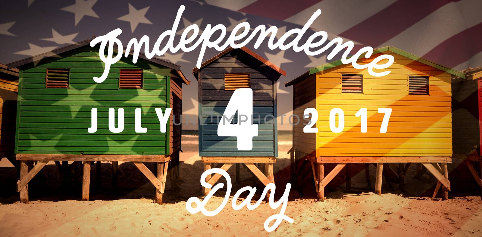 Digitally generated image of happy 4th of july message against colorful huts on sand at beach