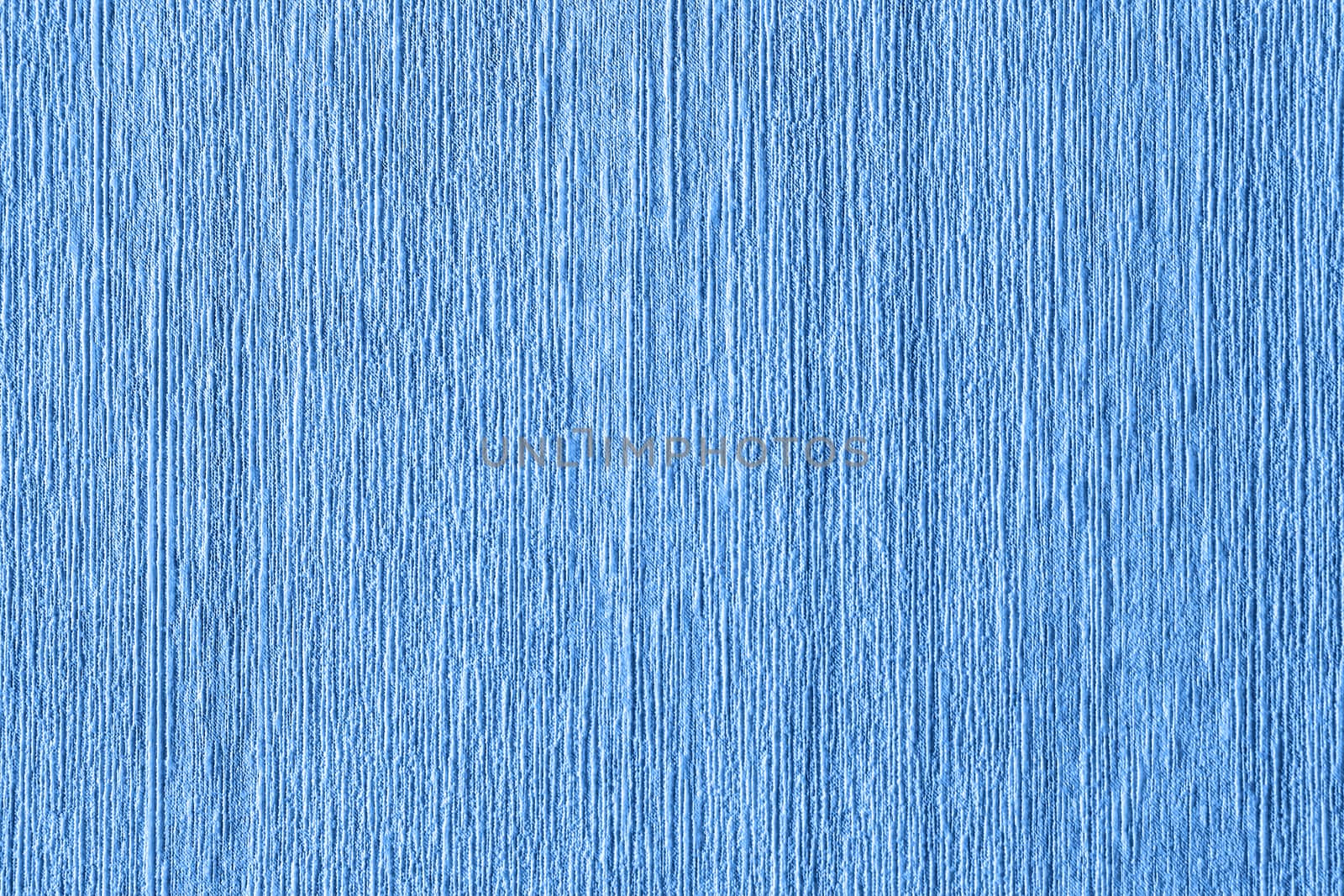 Abstract grungy decorative texture. Textured paper with copy space. Motley surface of blue paper, texture closeup.