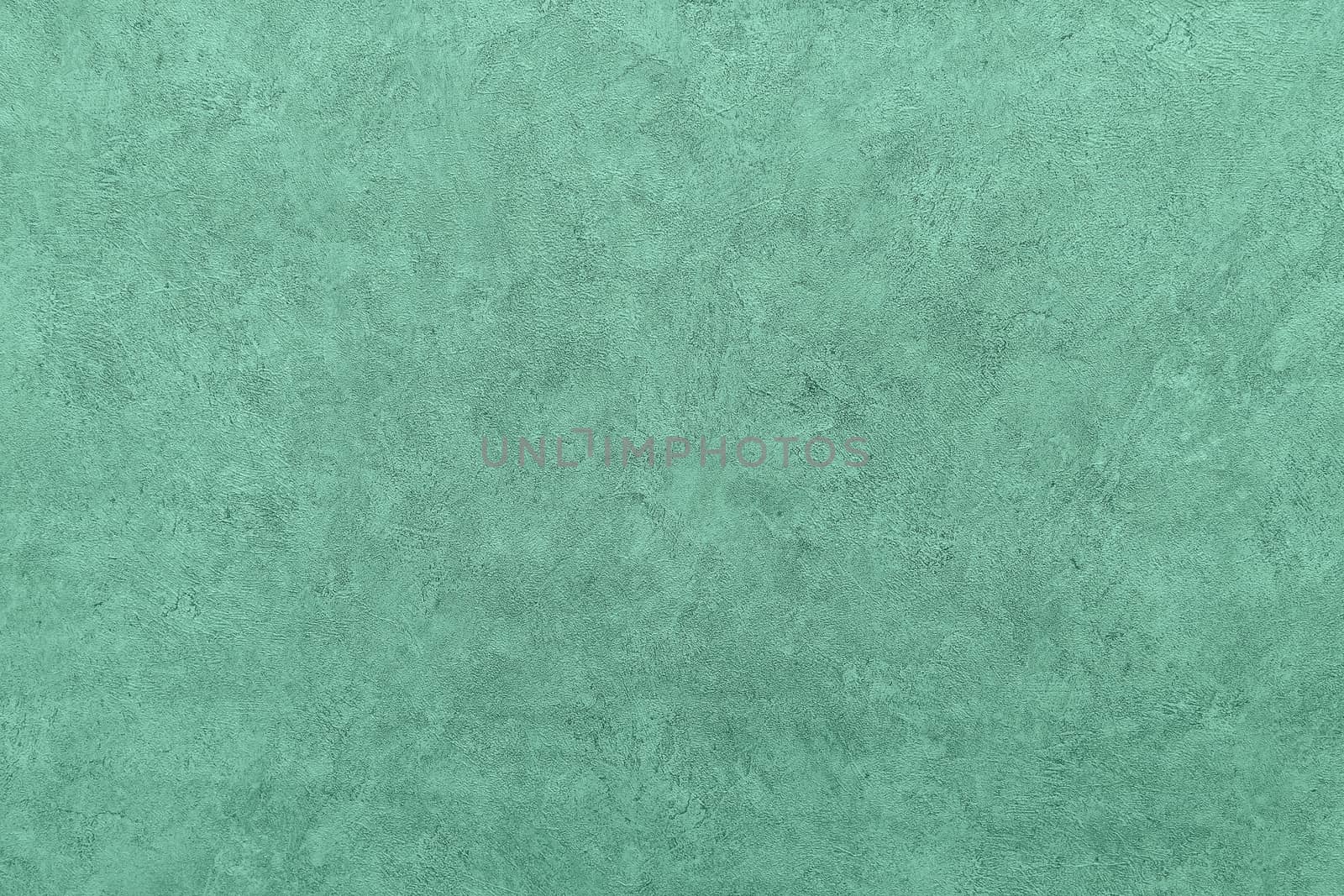 Abstract grungy decorative texture. Textured paper with copy space. Motley green paper surface, texture closeup.