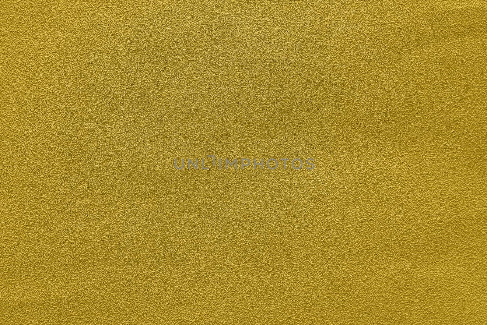 Abstract grungy decorative texture. Textured paper with copy space. The mottled surface of mustard yellow paper, texture closeup.