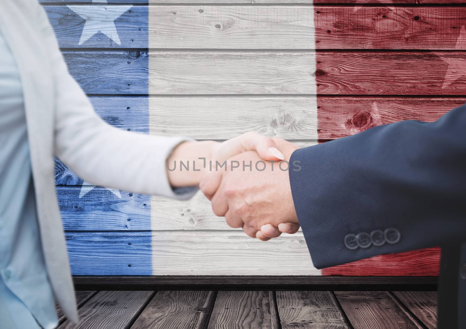Digital composite of People shaking their hands against french flag