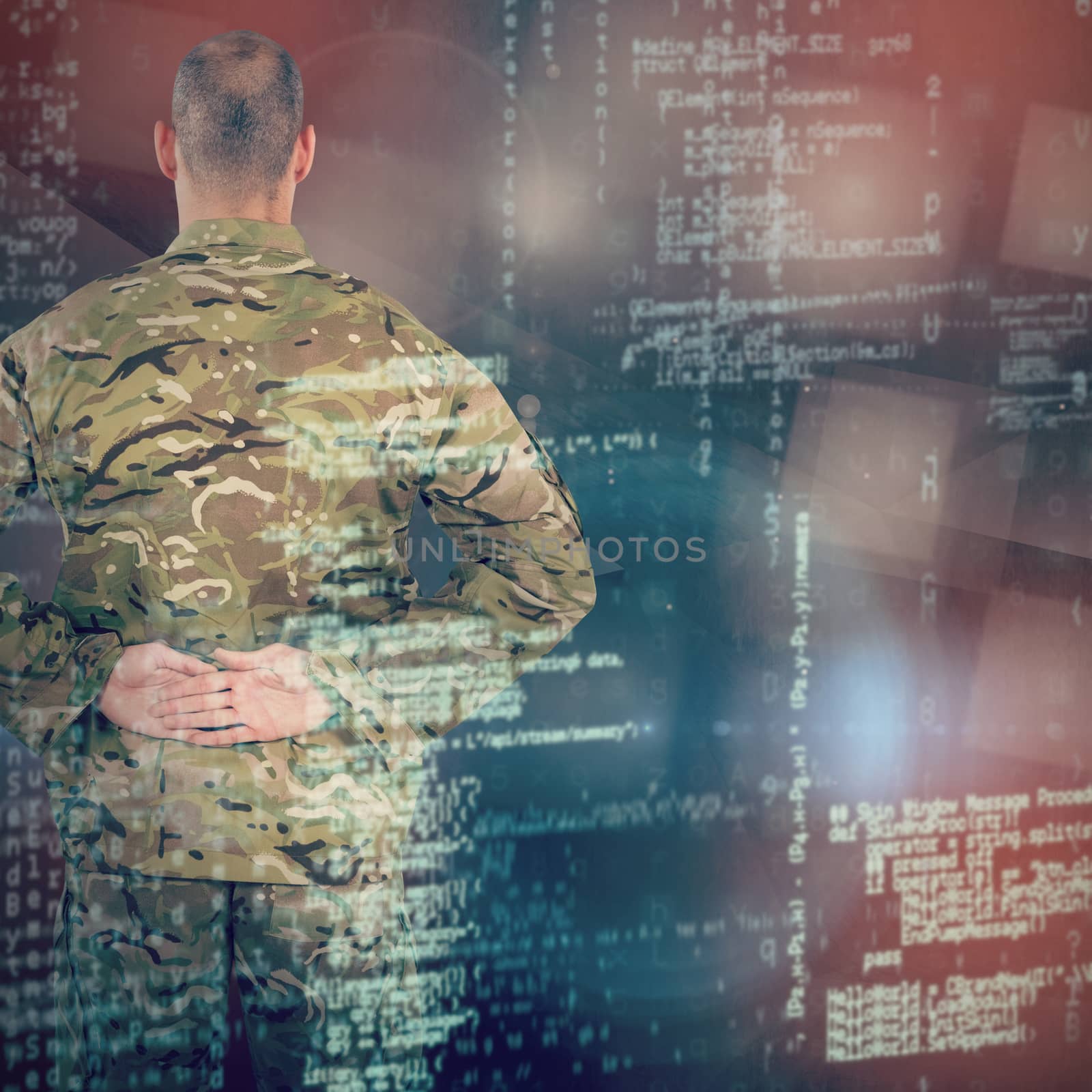 Composite image of rear view of soldier standing with his hands behind back by Wavebreakmedia