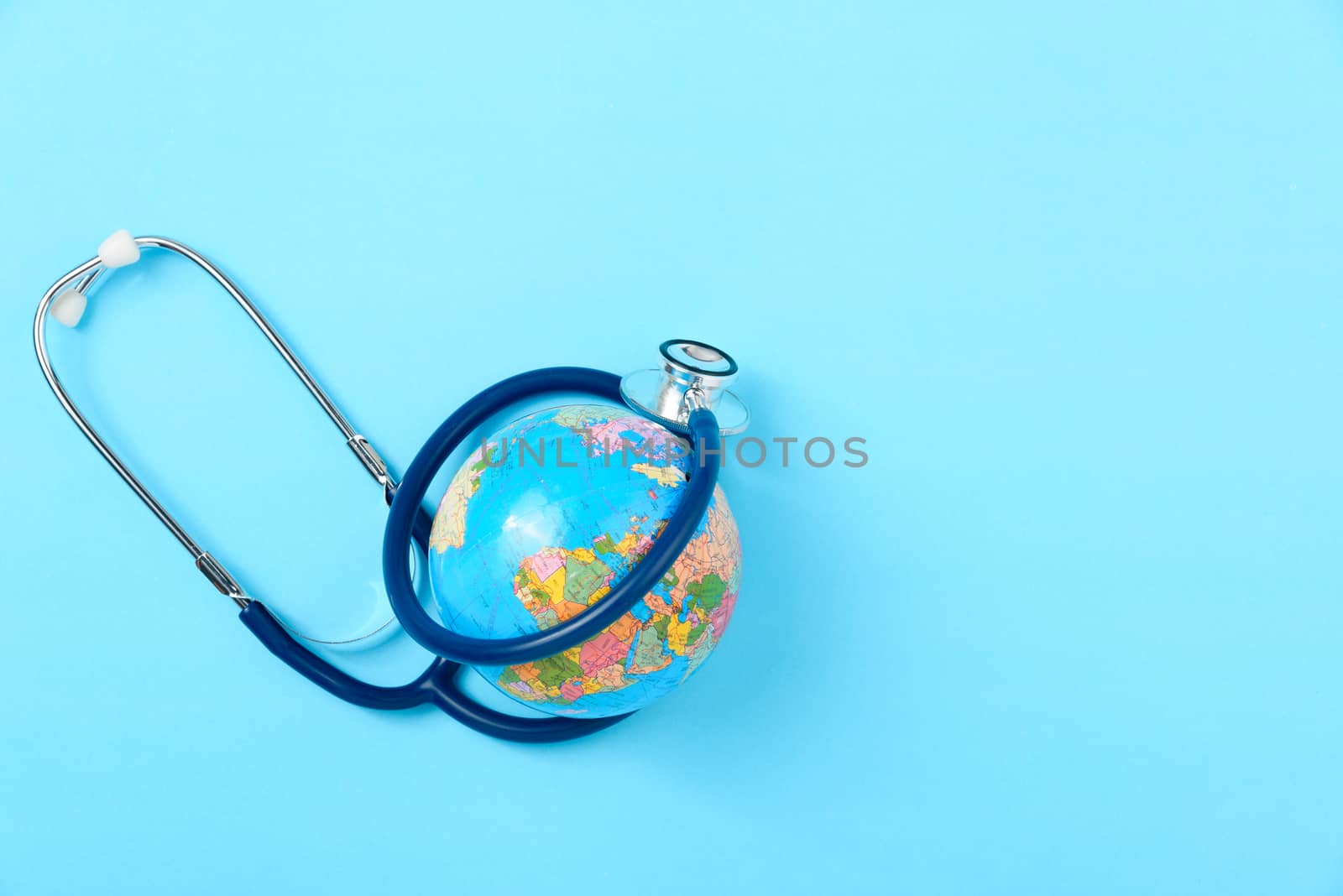World health day concept, Stethoscope, globe on blue background with copy space. Global health care