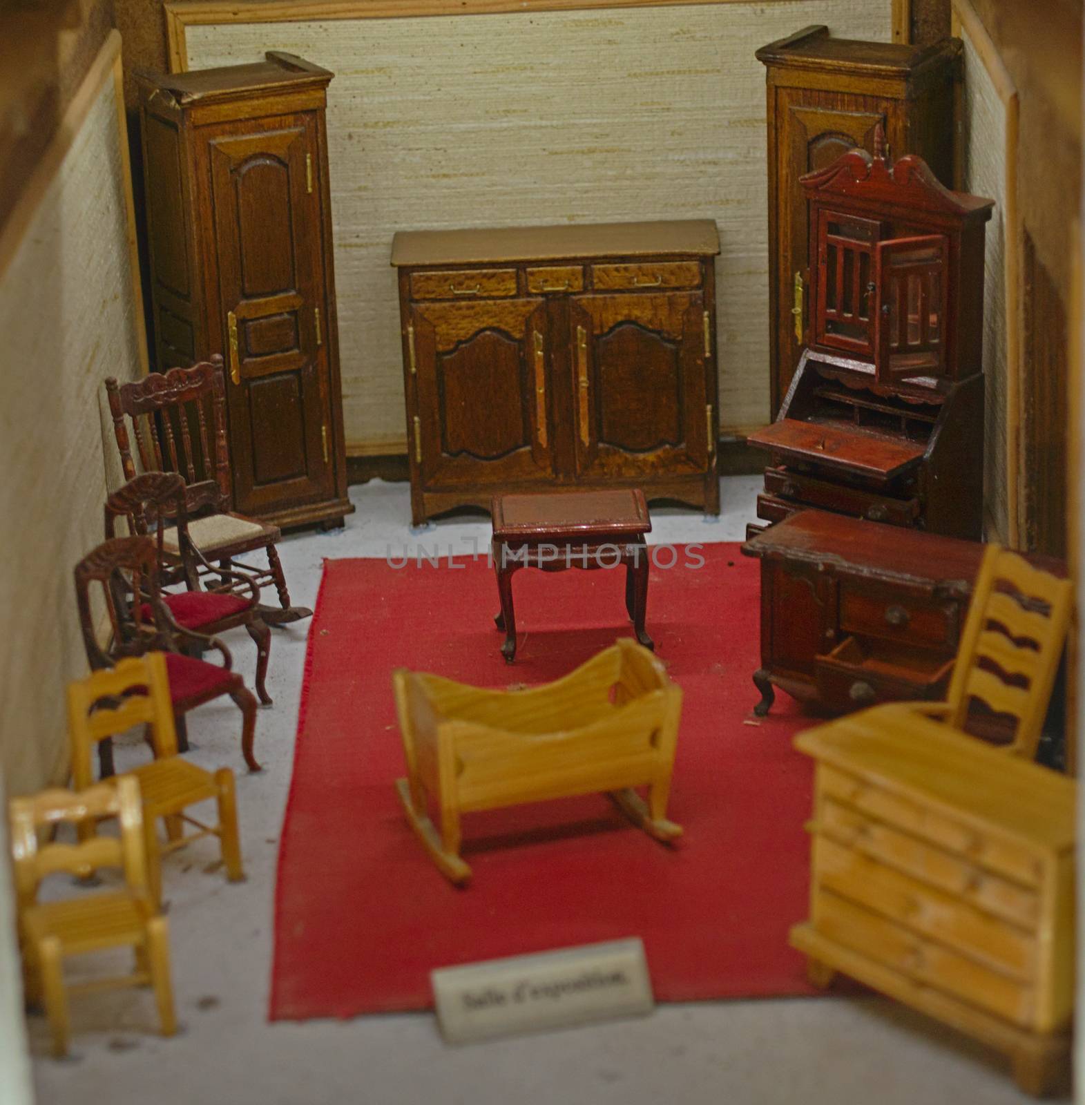 Small scale model representing room with old style wooden furniture