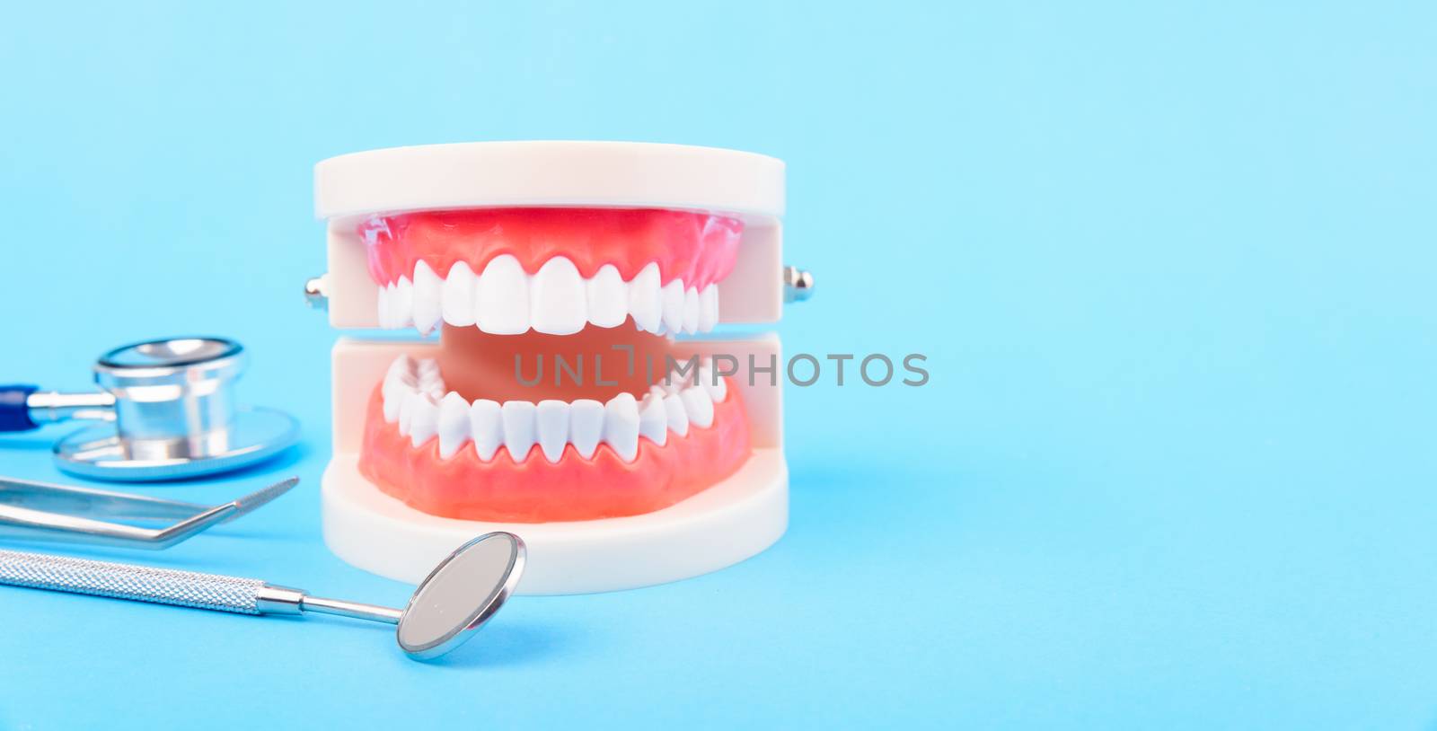 Dental Hygiene Health Concept, White tooth and Dentist tools for by Sorapop