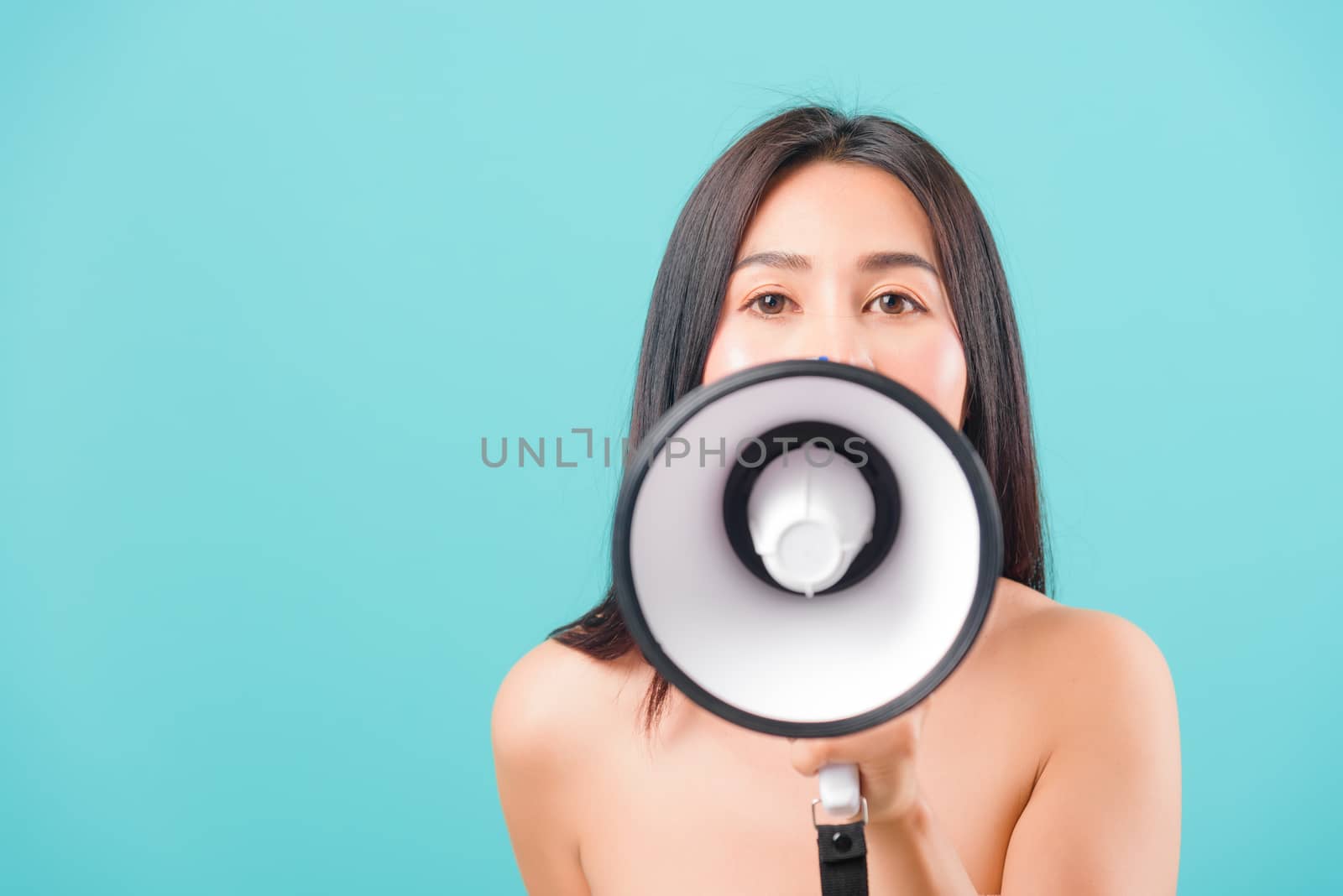 Smiling face portrait asian beautiful woman her usring megaphone by Sorapop